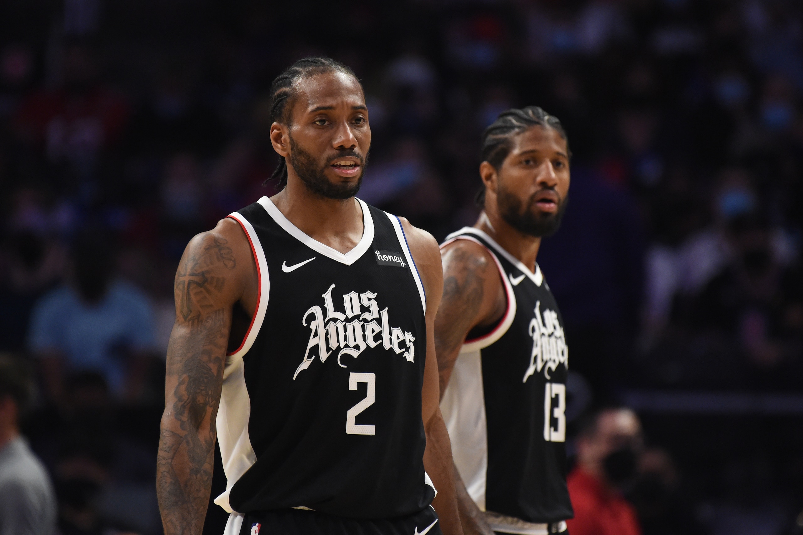 LOS ANGELES, CA - JUNE 12: Kawhi Leonard #2 of the LA Clippers and Paul George #13 of the LA Clippers looks on during Round 2, Game 3 of the 2021 NBA Playoffs on June 12, 2021 at STAPLES Center in Los Angeles, California. NOTE TO USER: User expressly acknowledges and agrees that, by downloading and/or using this Photograph, user is consenting to the terms and conditions of the Getty Images License Agreement. Mandatory Copyright Notice: Copyright 2021 NBAE (Photo by Juan Ocampo/NBAE via Getty Images)