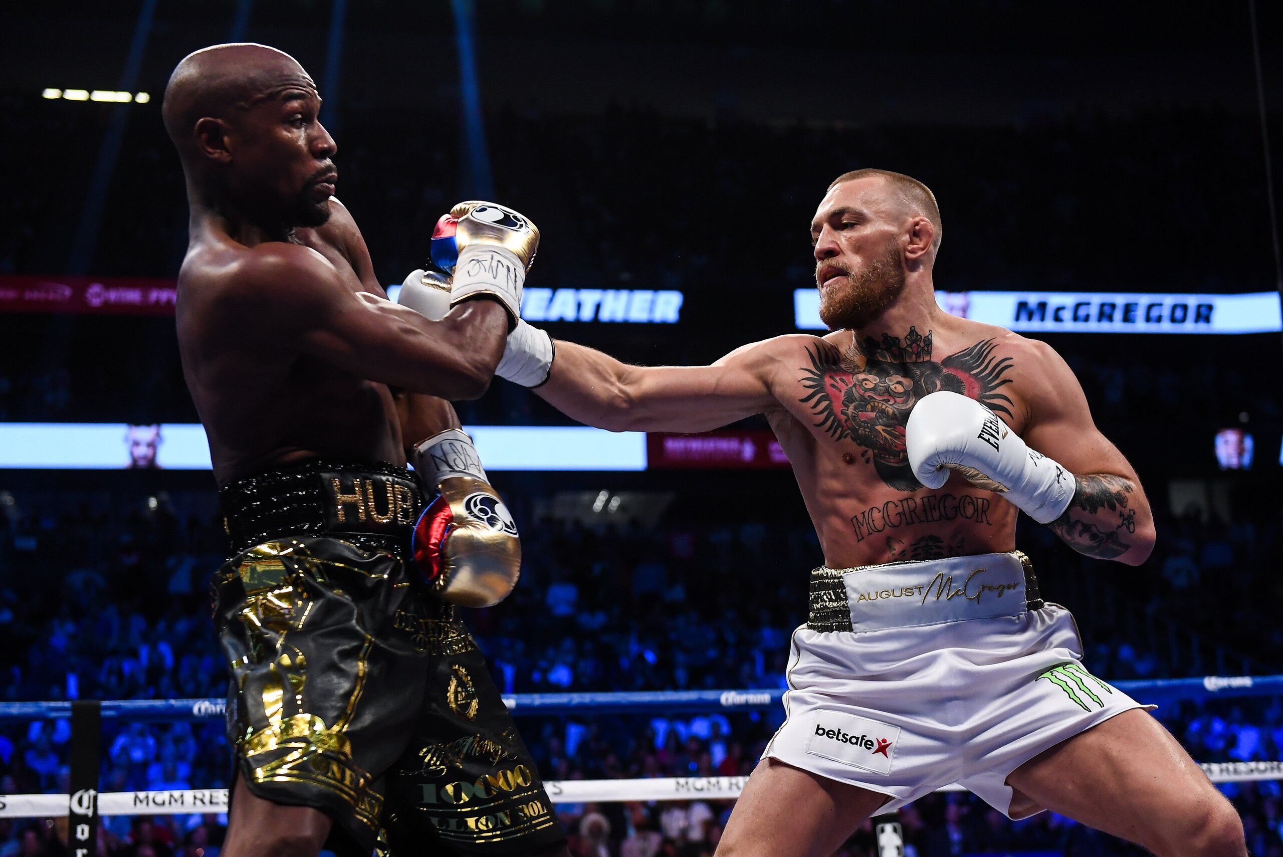 Nevada , United States - 26 August 2017; Conor McGregor, right, and Floyd Mayweather Jr during their super welterweight boxing match at T-Mobile Arena in Las Vegas, USA. (Photo By Stephen McCarthy/Sportsfile via Getty Images)