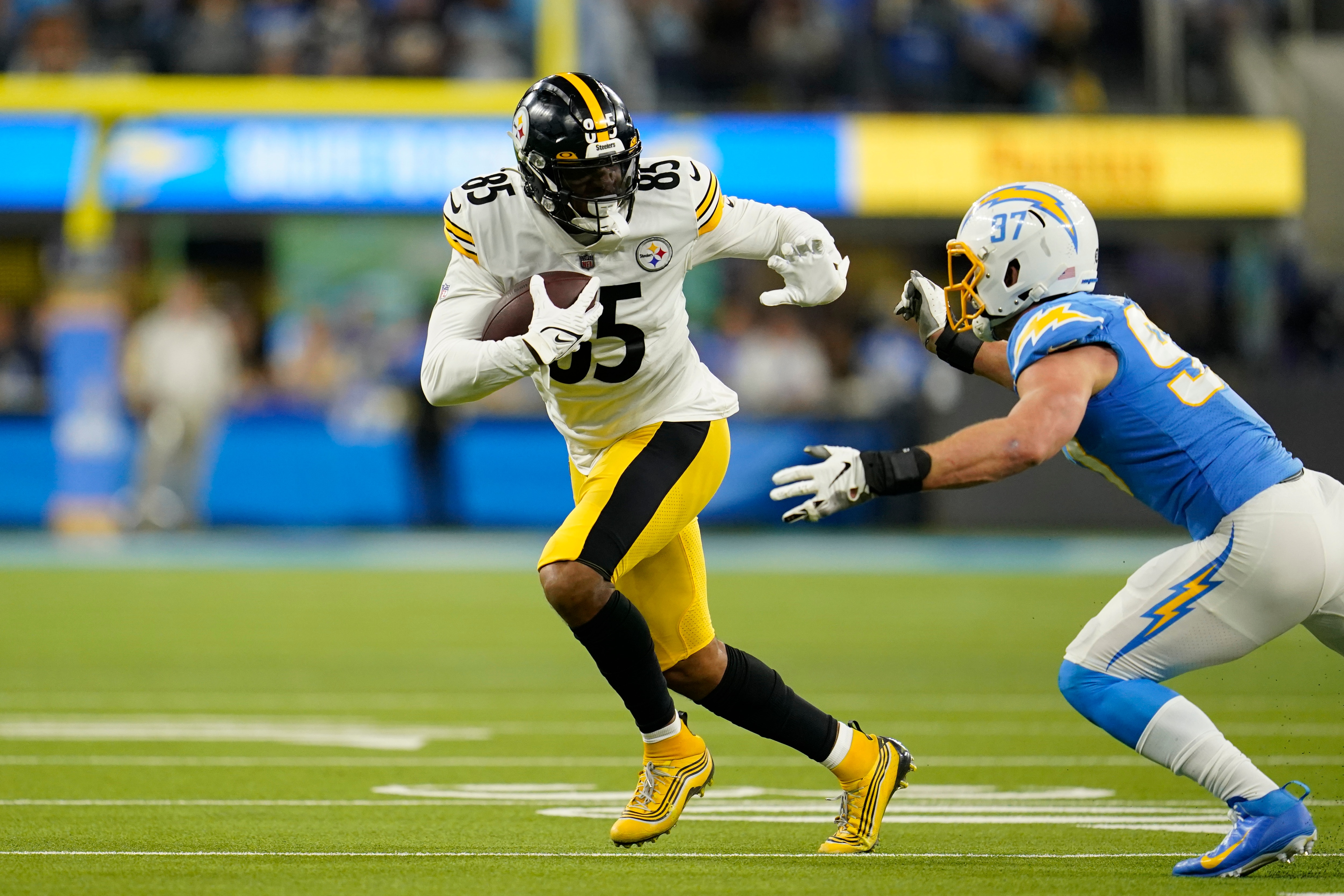 Pittsburgh Steelers tight end Eric Ebron, above, is brought down by Los Angeles Chargers defensive end Joey Bosa during the second half of an NFL football game Sunday, Nov. 21, 2021, in Inglewood, Calif. (AP Photo/Marcio Jose Sanchez)