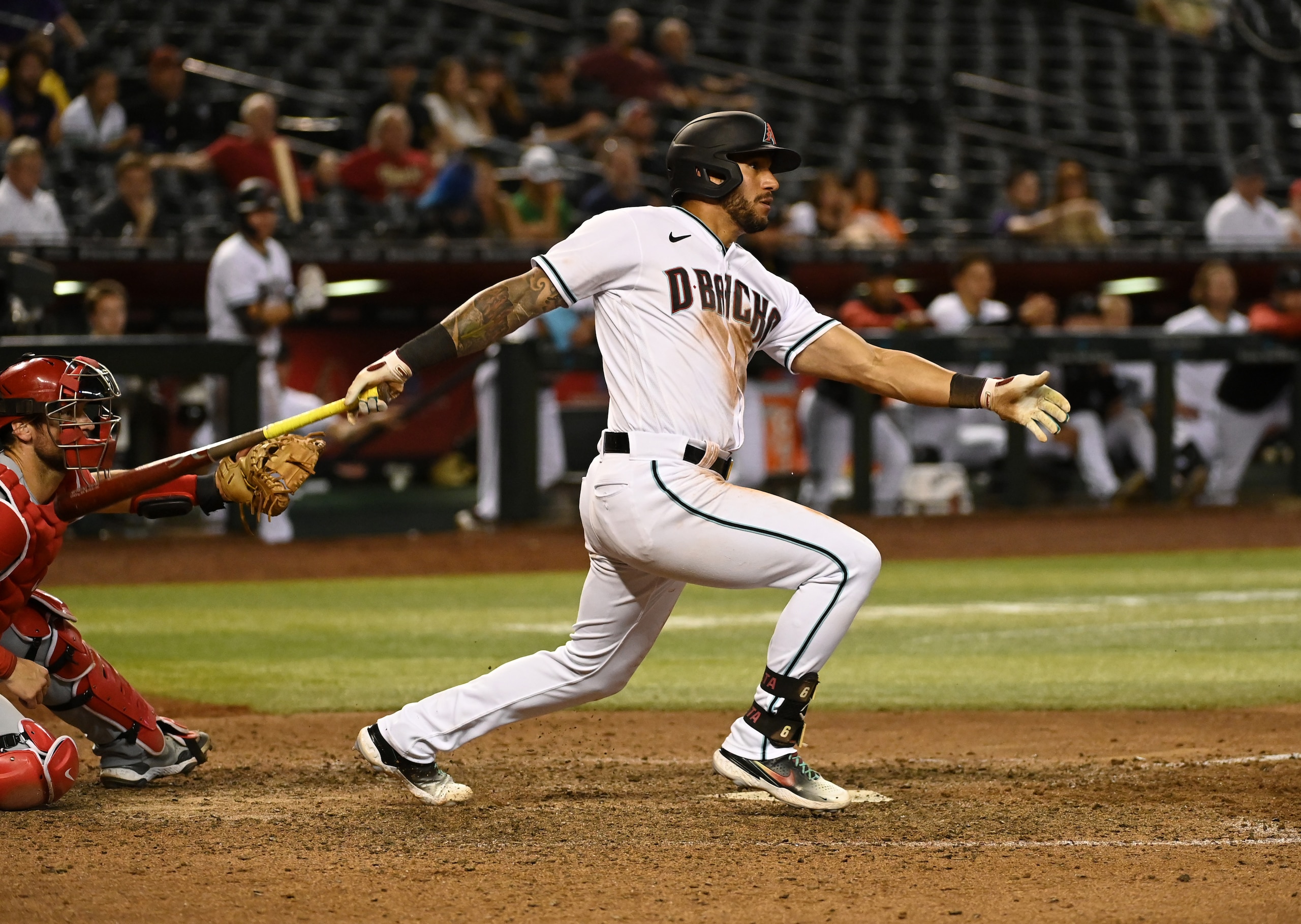 PHOENIX, ARIZONA - JUNE 14: David Peralta #6 of the Arizona Diamondbacks follows through on a swing against the Cincinnati Reds at Chase Field on June 14, 2022 in Phoenix, Arizona. (Photo by Norm Hall/Getty Images) PHOENIX, ARIZONA - JUNE 14: David Peralta #6 of the Arizona Diamondbacks follows through on a swing against the Cincinnati Reds at Chase Field on June 14, 2022 in Phoenix, Arizona. (Photo by Norm Hall/Getty Images)