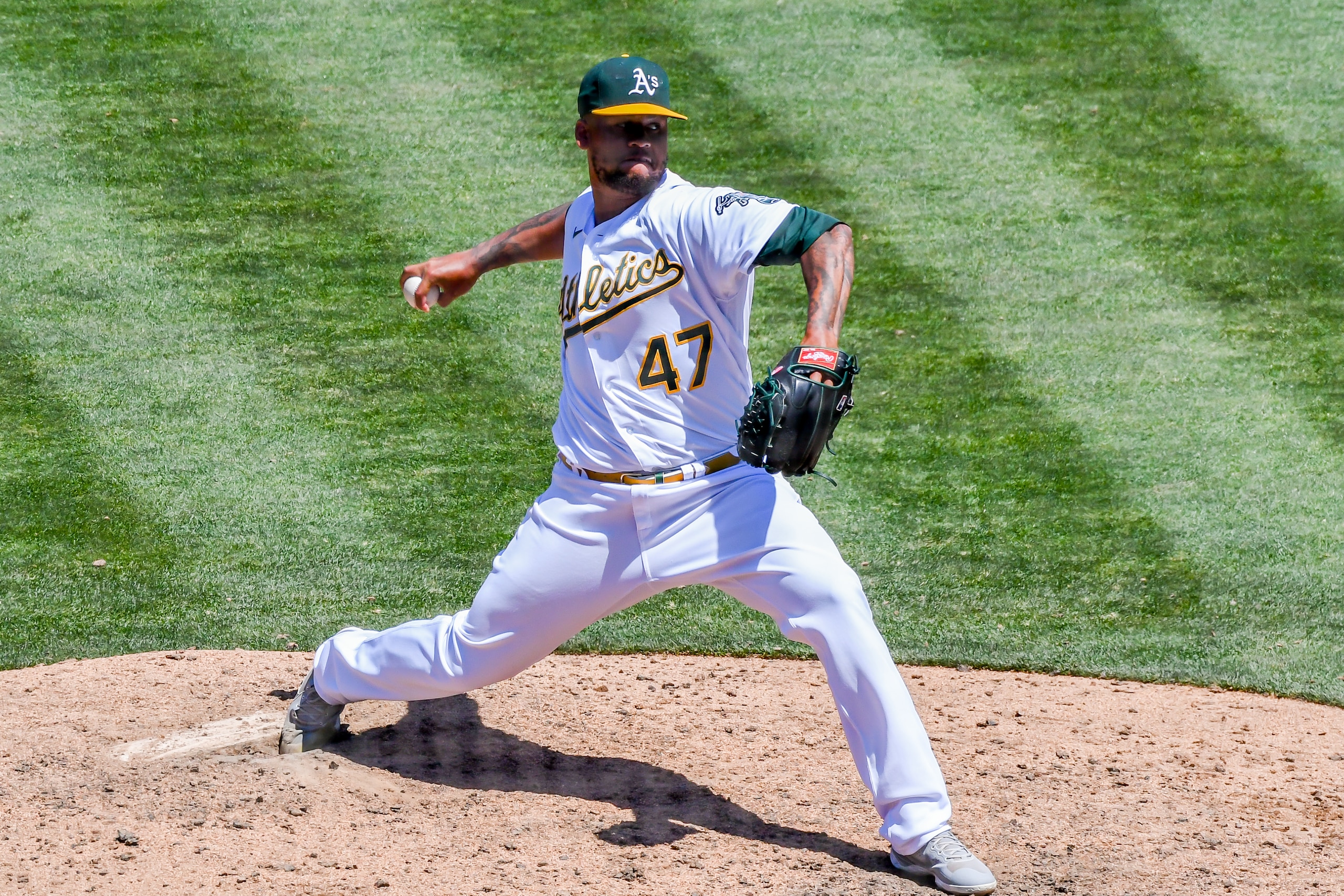 OAKLAND, CA - JUNE 23: Oakland Athletics starting pitcher Frankie Montas (47) braces against the mound board on a pitch during the game between the Seattle Mariners and the Oakland Athletics on Thursday, June 23, 2022 at the Oakland Coliseum in Oakland, California. (Photo by Douglas Stringer/Icon Sportswire via Getty Images)