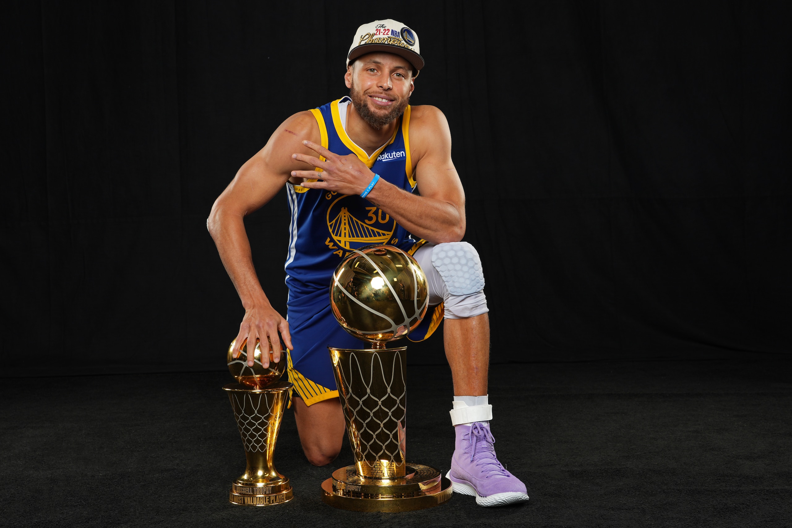 BOSTON, MA - JUNE 16: Stephen Curry #30  of the Golden State Warriors poses with the The Bill Russell NBA Finals Most Valuable Player Award and the Larry O'Brien NBA Championship Trophy after winning game 6 of the NBA finals against the Boston Celtics on June 16, 2022 at TD Garden in Boston, Massachusetts. NOTE TO USER: User expressly acknowledges and agrees that, by downloading and or using this photograph, user is consenting to the terms and conditions of Getty Images License Agreement. Mandatory Copyright Notice: Copyright 2022 NBAE (Photo by Jesse D. Garrabrant/NBAE via Getty Images)