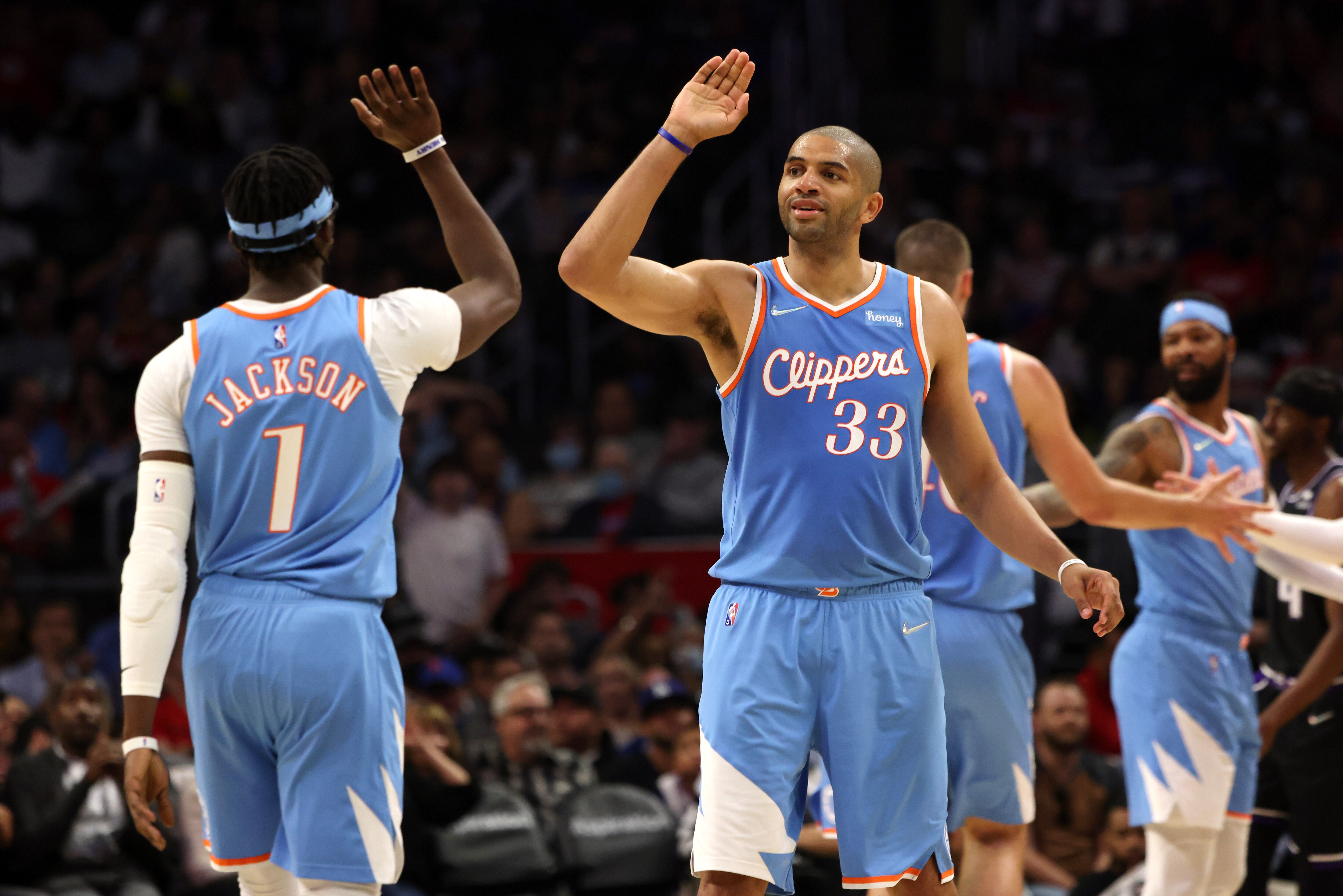 LOS ANGELES, CALIFORNIA - APRIL 09: Nicolas Batum #33 of the Los Angeles Clippers celebrates a play with teammate Reggie Jackson #1 during the second half against the Sacramento Kings at Crypto.com Arena on April 09, 2022 in Los Angeles, California. NOTE TO USER: User expressly acknowledges and agrees that, by downloading and or using this photograph, User is consenting to the terms and conditions of the Getty Images License Agreement. (Photo by Katelyn Mulcahy/Getty Images)