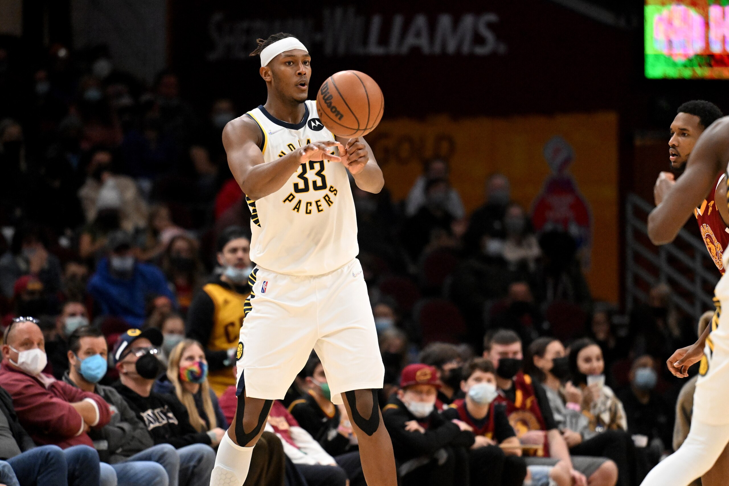 CLEVELAND, OHIO - JANUARY 02: Myles Turner #33 of the Indiana Pacers passes during the second half against the Cleveland Cavaliers at Rocket Mortgage Fieldhouse on January 02, 2022 in Cleveland, Ohio. The Cavaliers defeated the Pacers 108-104. NOTE TO USER: User expressly acknowledges and agrees that, by downloading and/or using this photograph, user is consenting to the terms and conditions of the Getty Images License Agreement. (Photo by Jason Miller/Getty Images)