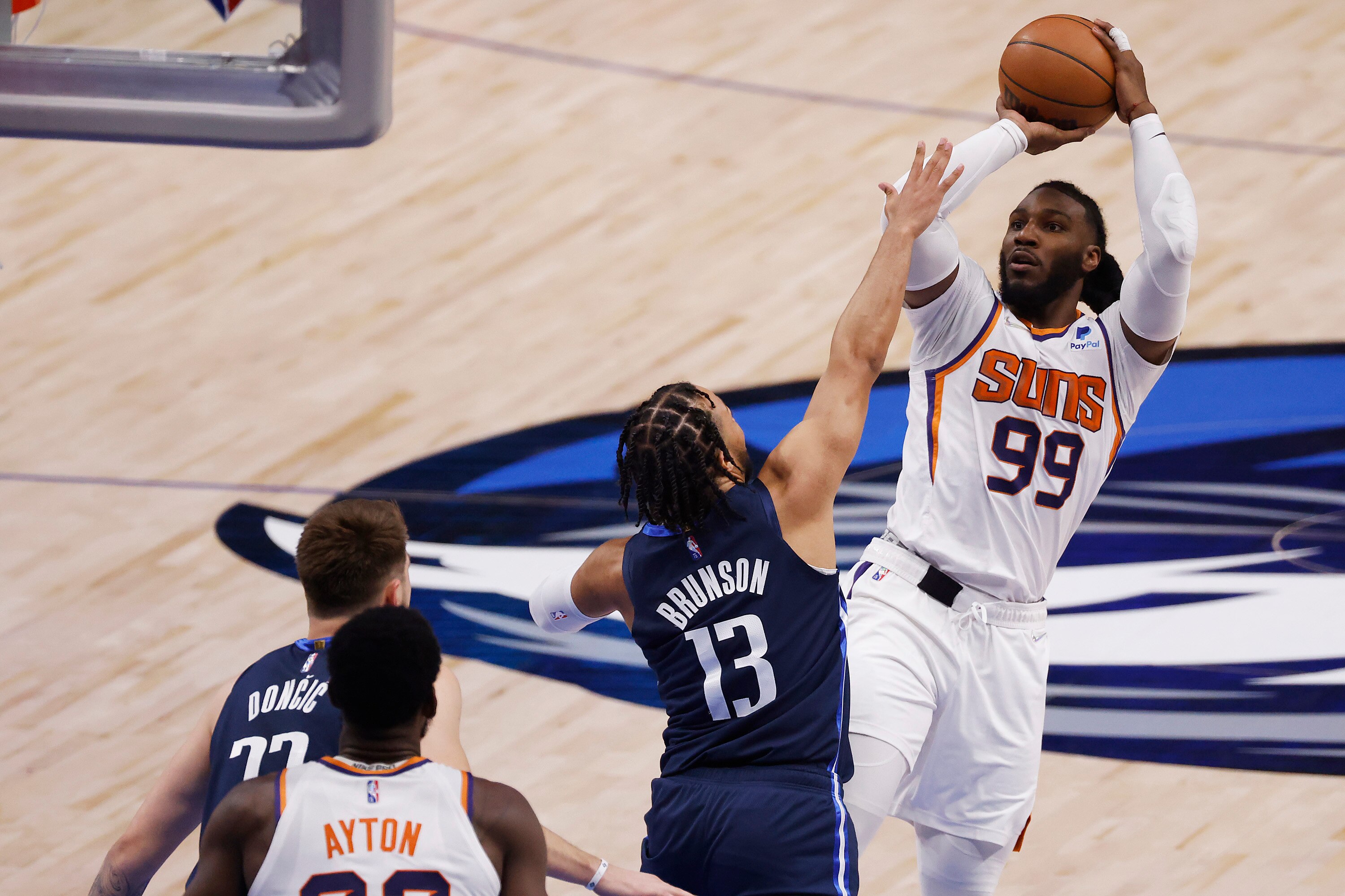 DALLAS, TEXAS - MAY 12:  Jae Crowder #99 of the Phoenix Suns shoots the ball against Jalen Brunson #13 of the Dallas Mavericks in the first quarter of Game Six of the 2022 NBA Playoffs Western Conference Semifinals at American Airlines Center on May 12, 2022 in Dallas, Texas. NOTE TO USER: User expressly acknowledges and agrees that, by downloading and/or using this photograph, User is consenting to the terms and conditions of the Getty Images License Agreement. (Photo by Ron Jenkins/Getty Images)