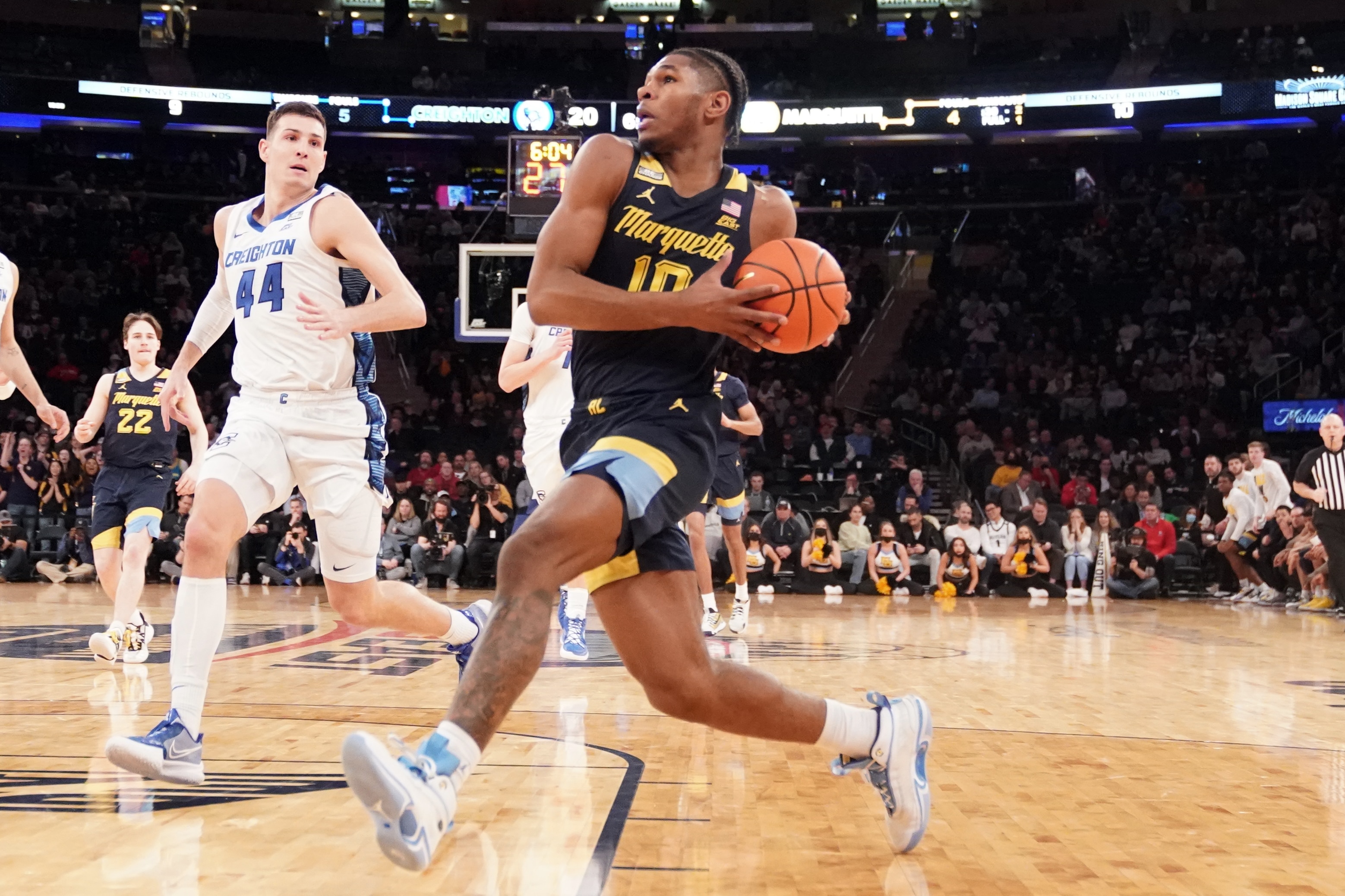 NEW YORK, NEW YORK - MARCH 10:  Justin Lewis #10 of the Marquette Golden Eagles drives to the basket during the quarterfinals of the Big East Basketball Tournament against the Creighton Bluejays at Madison Square Garden on March 10, 2022 in New York City.  (Photo by Mitchell Layton/Getty Images)