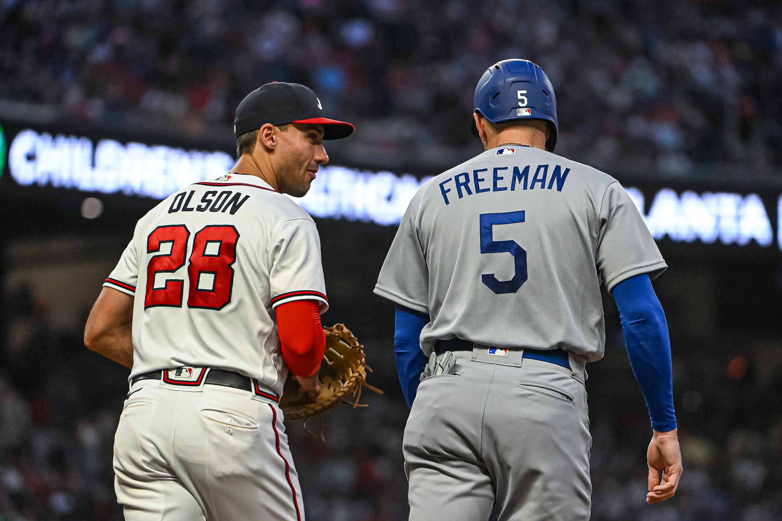 ATLANTA, GA - JUNE 26:Atlanta Braves first baseman Matt Olson (28) has a laugh with Los Angeles Dodgers first baseman Freddie Freeman (5) after Freemans single in the sixth inning of the MLB game between the Los Angeles Dodgers and Atlanta Braves on June 26, 2022, at Truist Park in Atlanta, GA. (Photo by John Adams/Icon Sportswire via Getty Images)