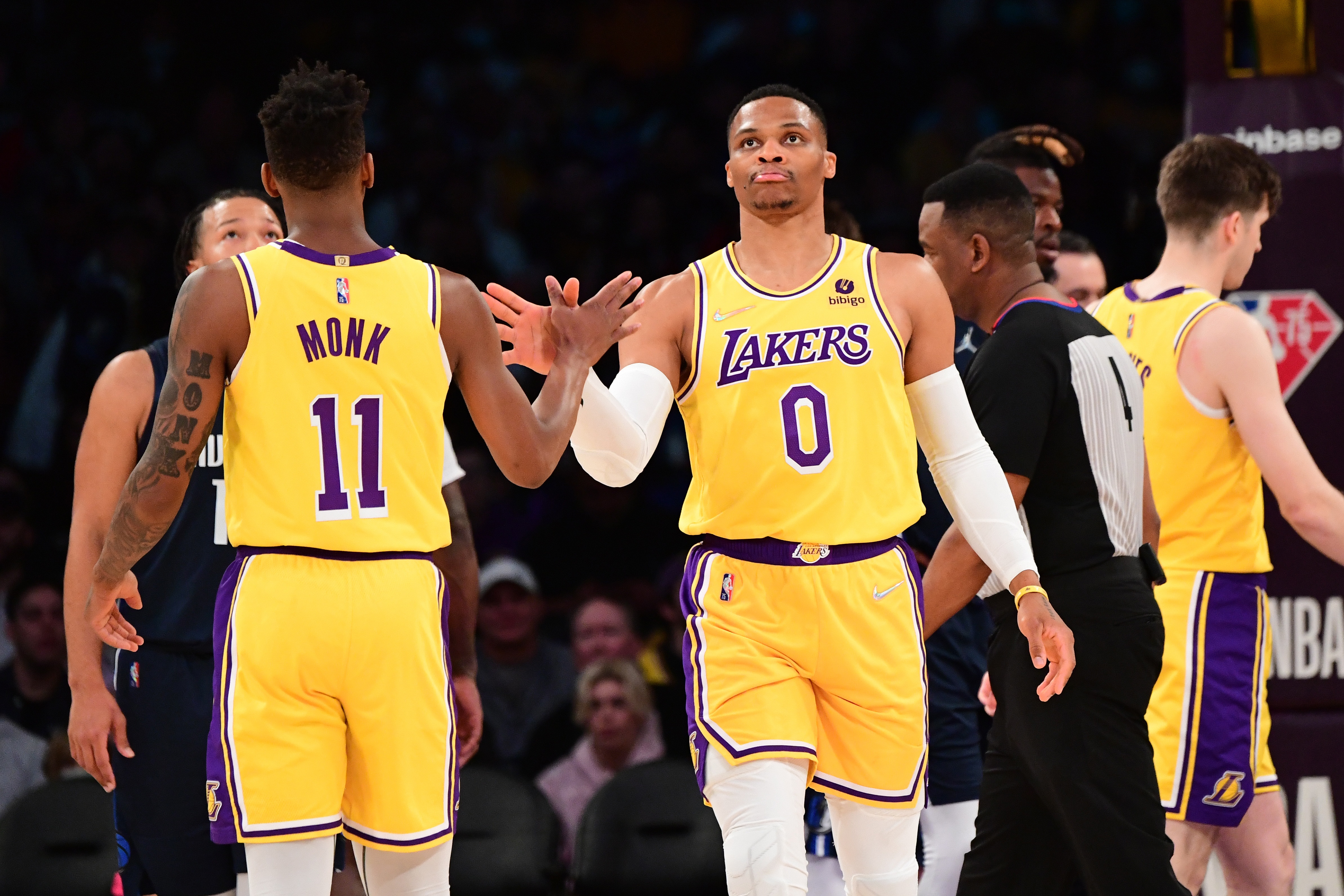 LOS ANGELES, CA - MARCH 1: Russell Westbrook #0 of the Los Angeles Lakers high fives Malik Monk #11 of the Los Angeles Lakers during the game against the Dallas Mavericks on March 1, 2022 at Crypto.Com Arena in Los Angeles, California. NOTE TO USER: User expressly acknowledges and agrees that, by downloading and/or using this Photograph, user is consenting to the terms and conditions of the Getty Images License Agreement. Mandatory Copyright Notice: Copyright 2022 NBAE (Photo by Adam Pantozzi/NBAE via Getty Images)