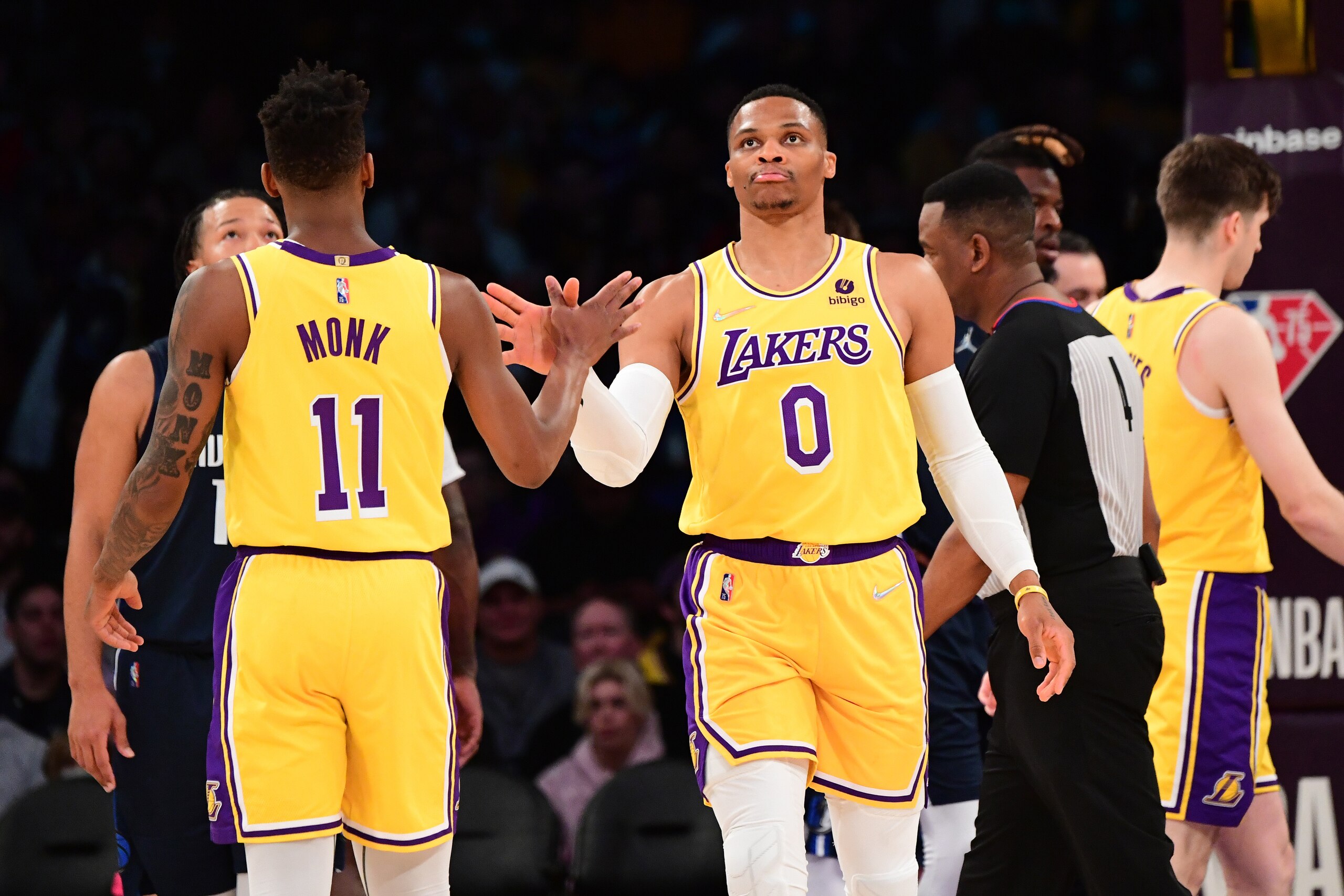 LOS ANGELES, CA - MARCH 1: Russell Westbrook #0 of the Los Angeles Lakers high fives Malik Monk #11 of the Los Angeles Lakers during the game against the Dallas Mavericks on March 1, 2022 at Crypto.Com Arena in Los Angeles, California. NOTE TO USER: User expressly acknowledges and agrees that, by downloading and/or using this Photograph, user is consenting to the terms and conditions of the Getty Images License Agreement. Mandatory Copyright Notice: Copyright 2022 NBAE (Photo by Adam Pantozzi/NBAE via Getty Images)