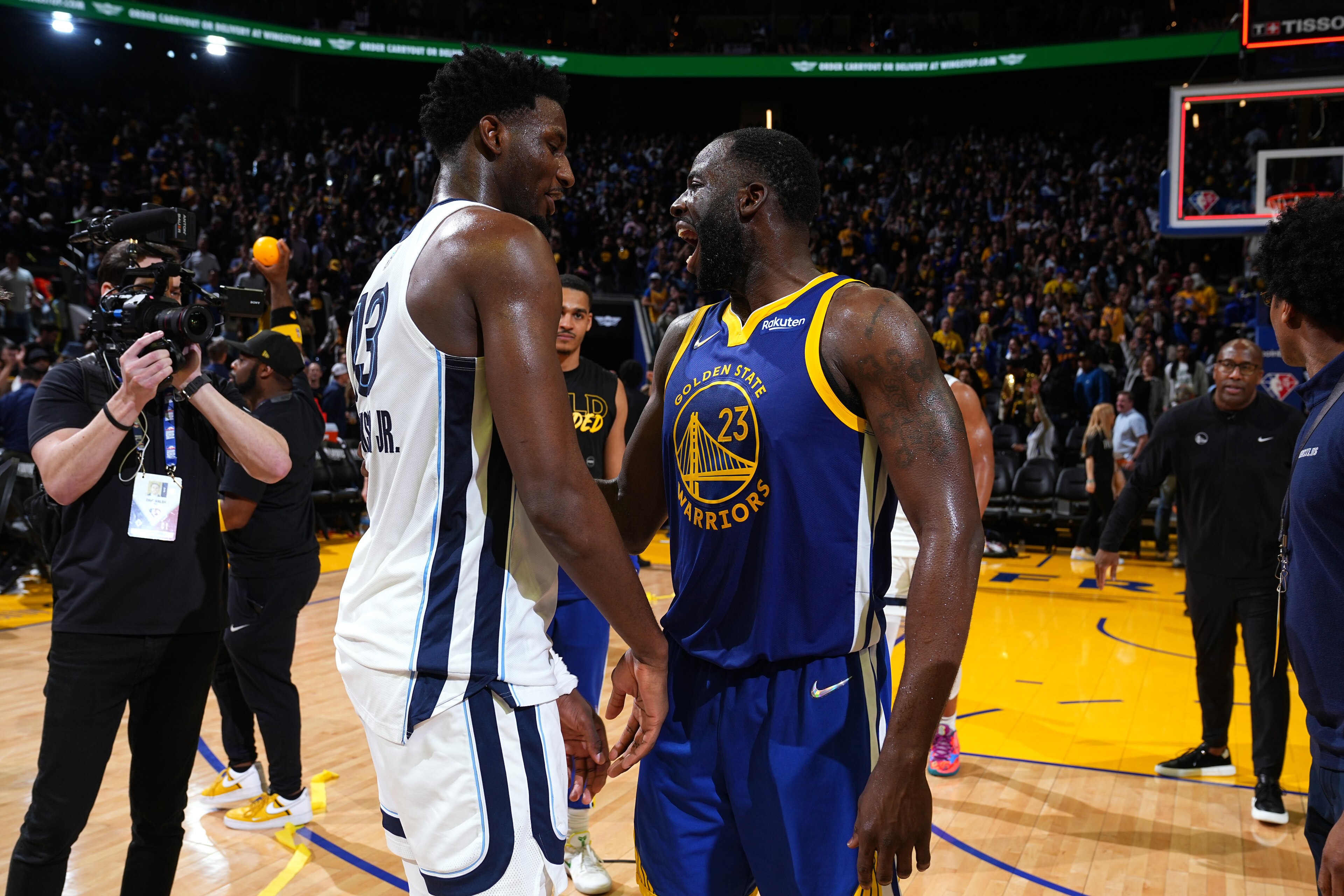 SAN FRANCISCO, CA - MAY 13: Jaren Jackson Jr. #13 of the Memphis Grizzlies and Draymond Green #23 of the Golden State Warriors embrace after Game 6 of the 2022 NBA Playoffs Western Conference Semifinals on May 13, 2022 at Chase Center in San Francisco, California. NOTE TO USER: User expressly acknowledges and agrees that, by downloading and or using this photograph, user is consenting to the terms and conditions of Getty Images License Agreement. Mandatory Copyright Notice: Copyright 2022 NBAE (Photo by Garrett Ellwood/NBAE via Getty Images) SAN FRANCISCO, CA - MAY 13: Jaren Jackson Jr. #13 of the Memphis Grizzlies and Draymond Green #23 of the Golden State Warriors embrace after Game 6 of the 2022 NBA Playoffs Western Conference Semifinals on May 13, 2022 at Chase Center in San Francisco, California. NOTE TO USER: User expressly acknowledges and agrees that, by downloading and or using this photograph, user is consenting to the terms and conditions of Getty Images License Agreement. Mandatory Copyright Notice: Copyright 2022 NBAE (Photo by Garrett Ellwood/NBAE via Getty Images)
