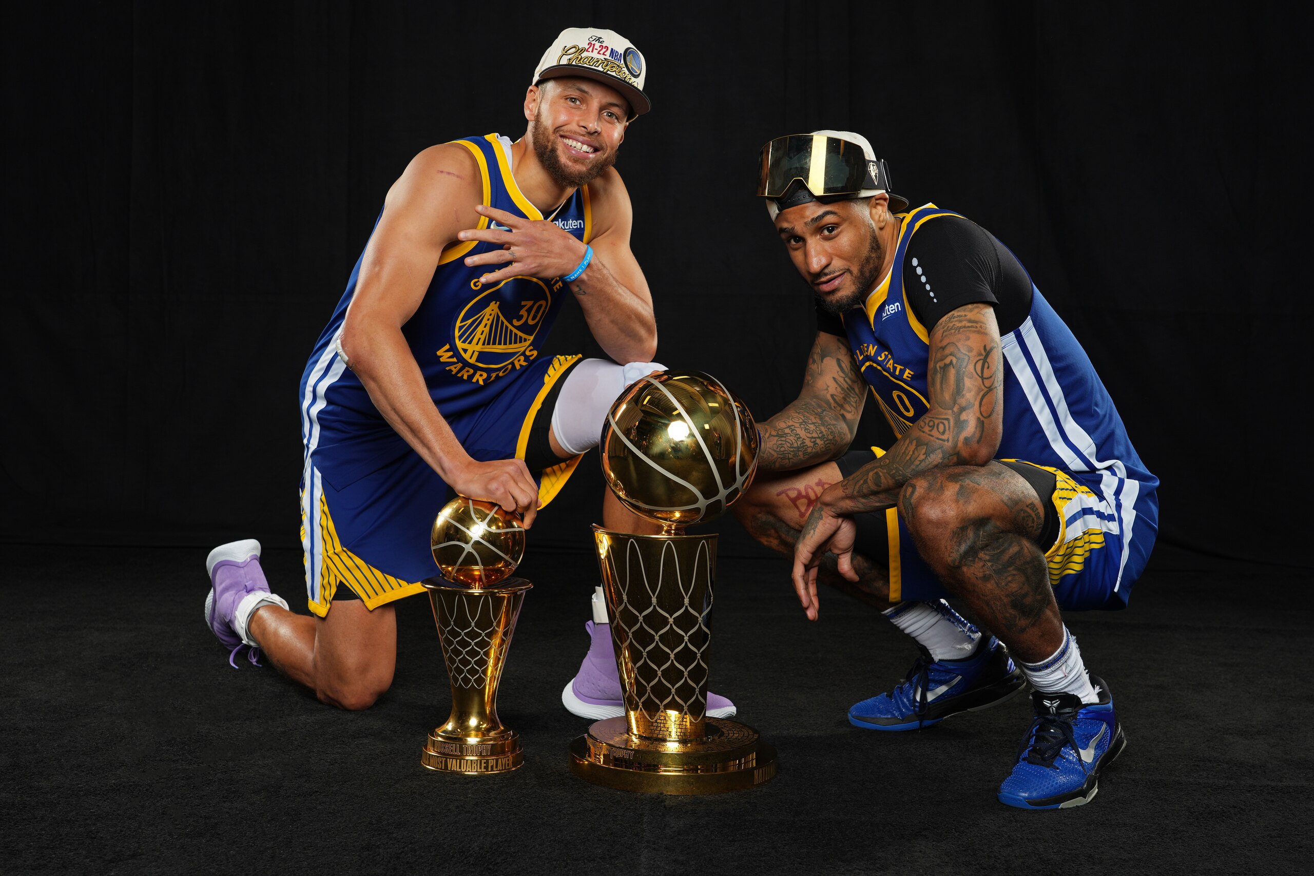 BOSTON, MA - JUNE 16: Stephen Curry #30 and Gary Payton II #0 of the Golden State Warriors pose with the The Bill Russell NBA Finals Most Valuable Player Award and the Larry O'Brien NBA Championship Trophy after winning game 6 of the NBA finals against the Boston Celtics on June 16, 2022 at TD Garden in Boston, Massachusetts. NOTE TO USER: User expressly acknowledges and agrees that, by downloading and or using this photograph, user is consenting to the terms and conditions of Getty Images License Agreement. Mandatory Copyright Notice: Copyright 2022 NBAE (Photo by Jesse D. Garrabrant/NBAE via Getty Images)