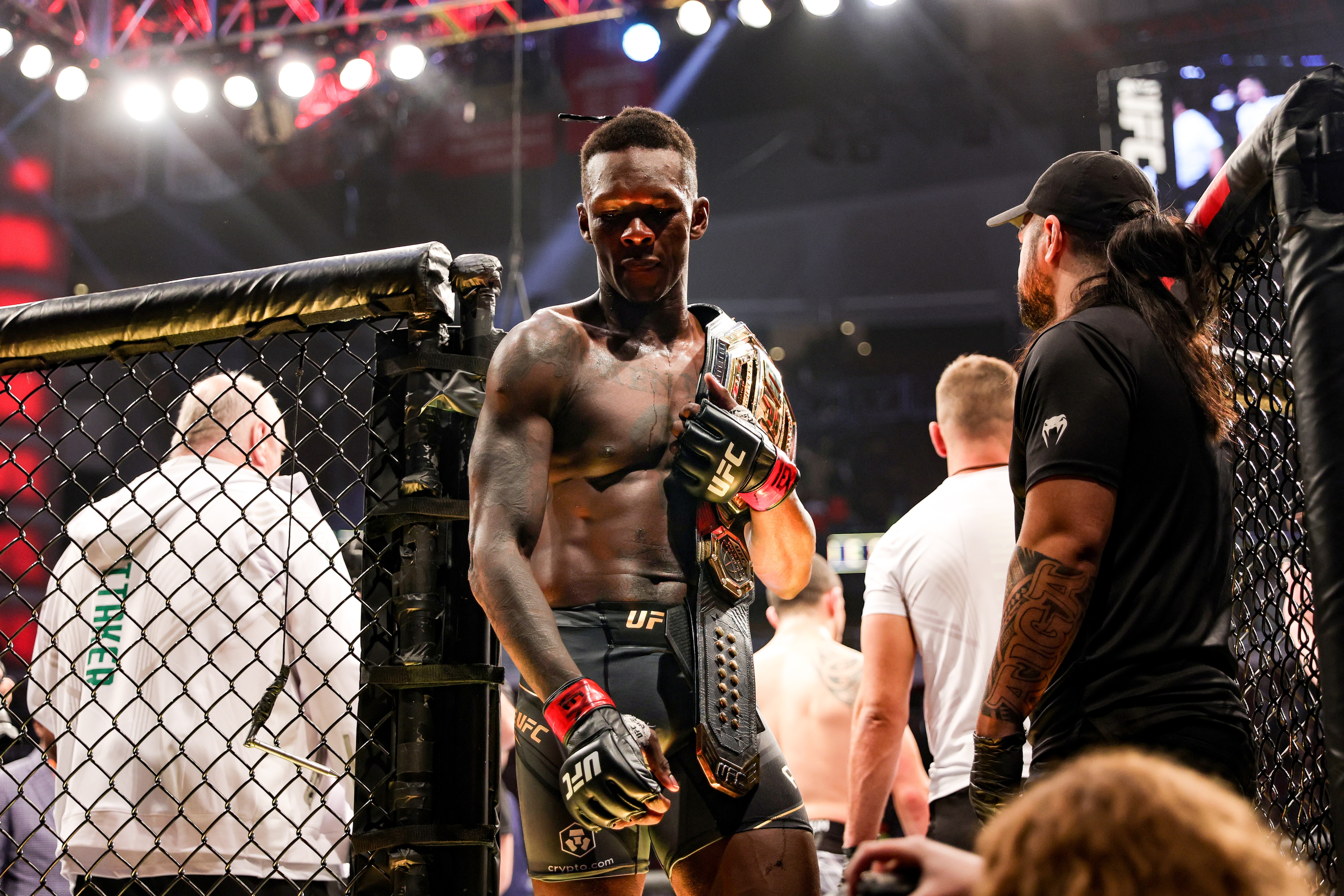 HOUSTON, TEXAS - FEBRUARY 12: Israel Adesanya of Nigeria celebrates after defending his middleweight championship against Robert Whittaker of Australia during UFC 271 at Toyota Center on February 12, 2022 in Houston, Texas. (Photo by Carmen Mandato/Getty Images)