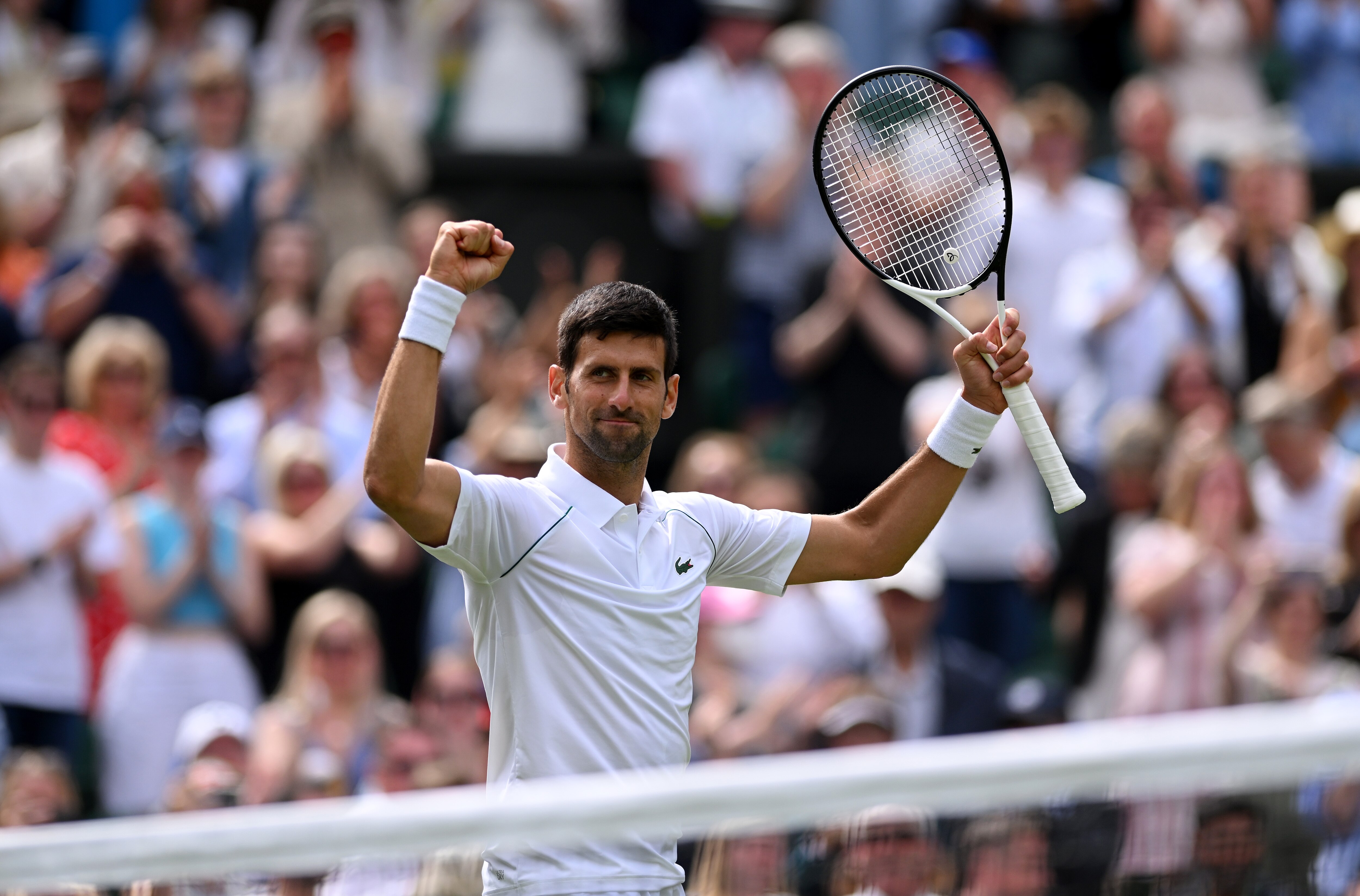 LONDON, ENGLAND - JUNE 29: Novak Djokovic of Serbia celebrates winning match point during their Men's Singles Second Round match against Thanasi Kokkinakis of Australia on day three of The Championships Wimbledon 2022 at All England Lawn Tennis and Croquet Club on June 29, 2022 in London, England. (Photo by Shaun Botterill/Getty Images)