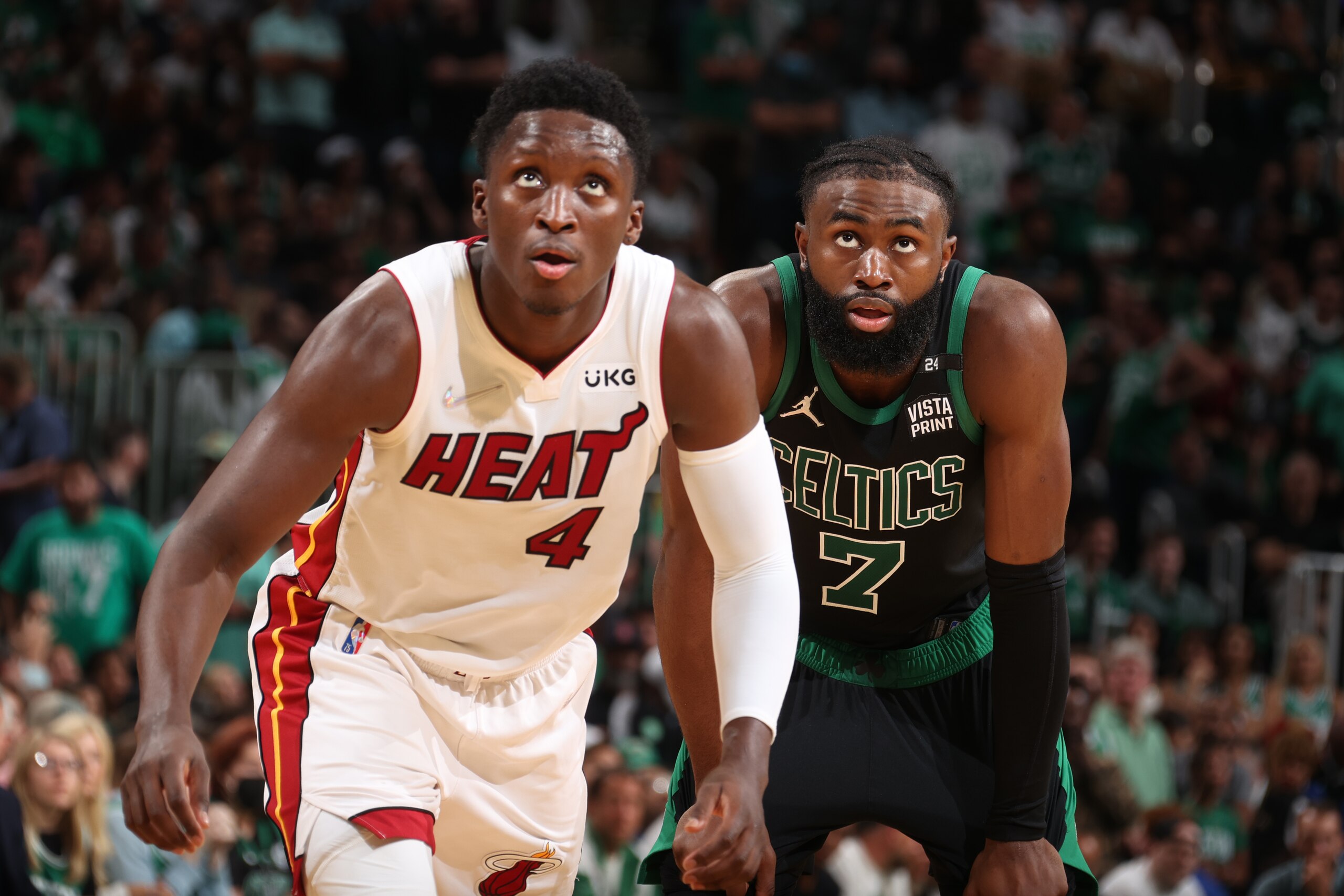 BOSTON, MA - MAY 27: Victor Oladipo #4 of the Miami Heat and Jaylen Brown #7 of the Boston Celtics look on during Game 6 of the 2022 NBA Playoffs Eastern Conference Finals on May 27, 2022 at the TD Garden in Boston, Massachusetts.  NOTE TO USER: User expressly acknowledges and agrees that, by downloading and or using this photograph, User is consenting to the terms and conditions of the Getty Images License Agreement. Mandatory Copyright Notice: Copyright 2022 NBAE  (Photo by Nathaniel S. Butler/NBAE via Getty Images)