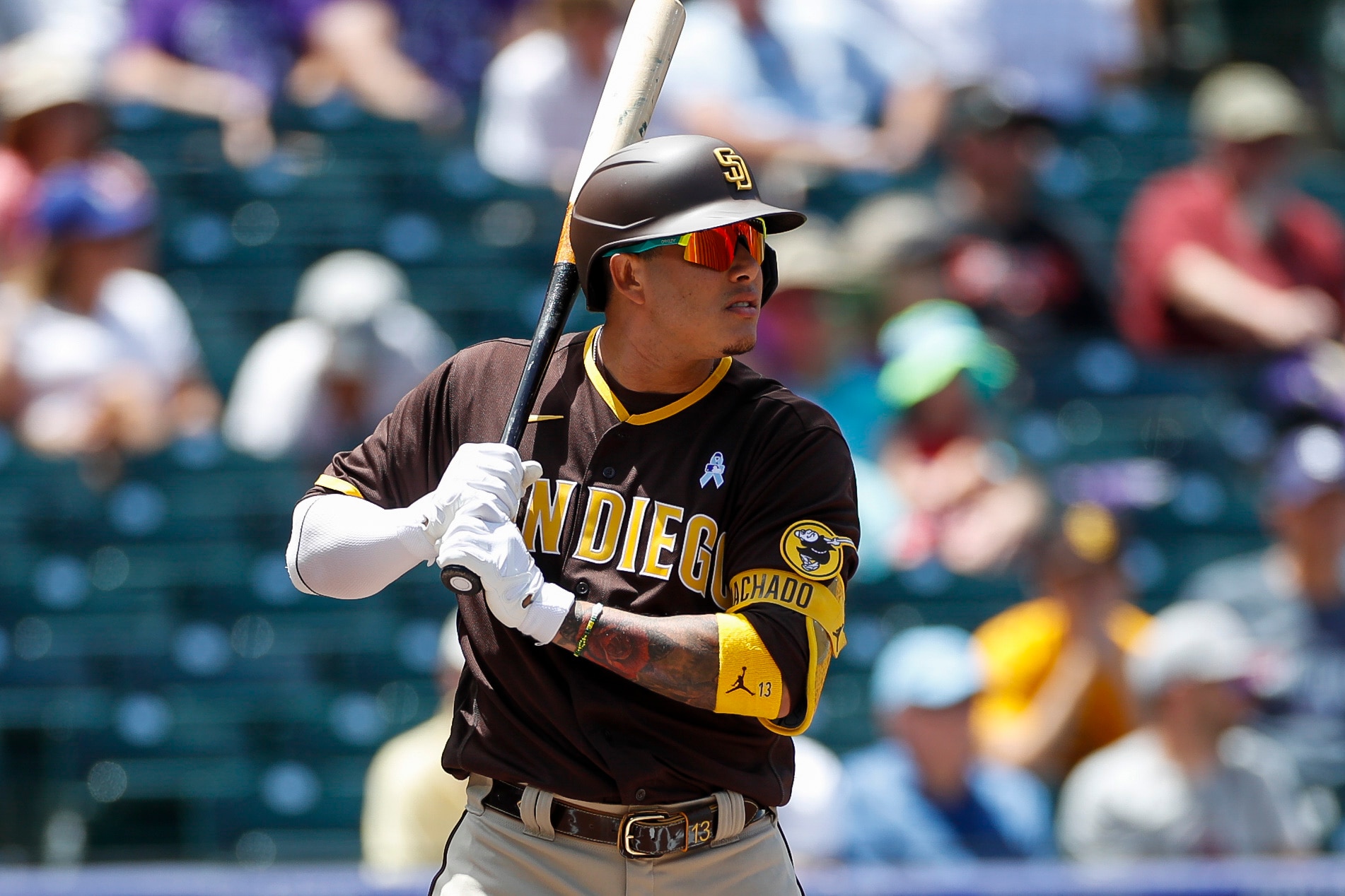 DENVER, CO - JUNE 19: San Diego Padres third baseman Manny Machado (13) waits for the pitch in the first inning during a regular season game between the San Diego Padres and Colorado Rockies on June 19, 2022, at Coors Field in Denver, CO. (Photo by Brandon Sloter/Icon Sportswire via Getty Images)