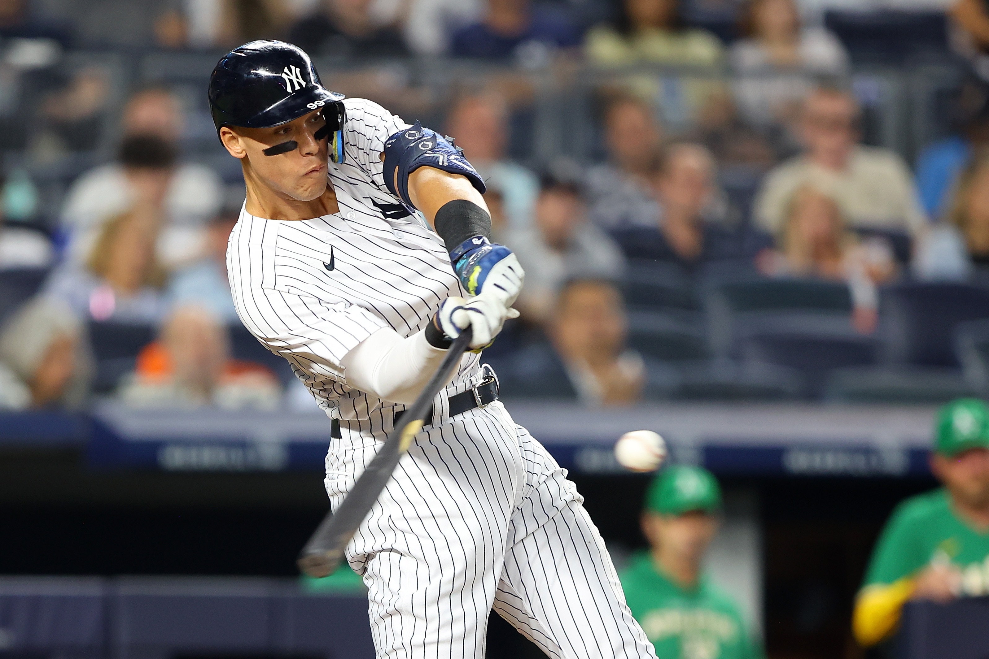 NEW YORK, NEW YORK - JUNE 27: Aaron Judge #99 of the New York Yankees hits a RBI single to left field in the fifth inning against the Oakland Athletics at Yankee Stadium on June 27, 2022 in New York City. (Photo by Mike Stobe/Getty Images)