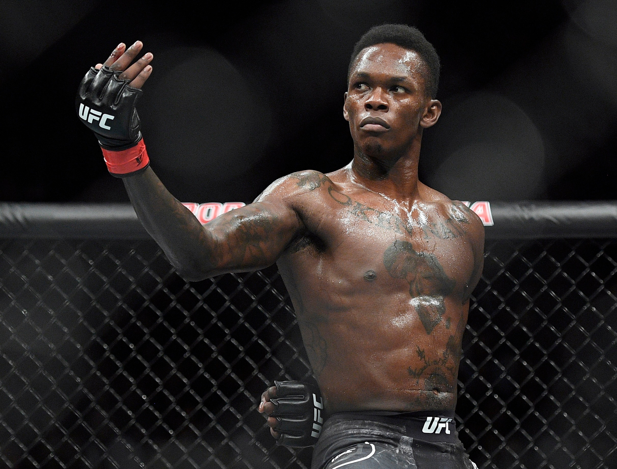 FILE - In this Feb. 10, 2019, file photo, Nigeria's Israel Adesanya poses as he fights Brazil's Anderson Silva in their middleweight bout at the UFC 234 mixed martial arts fights in Melbourne, Australia. Adesanya challenges champion Jan Blachowicz of Poland for the light heavyweight title in the main event of UFC 259 on Saturday in Las Vegas. (AP Photo/Andy Brownbill, File)