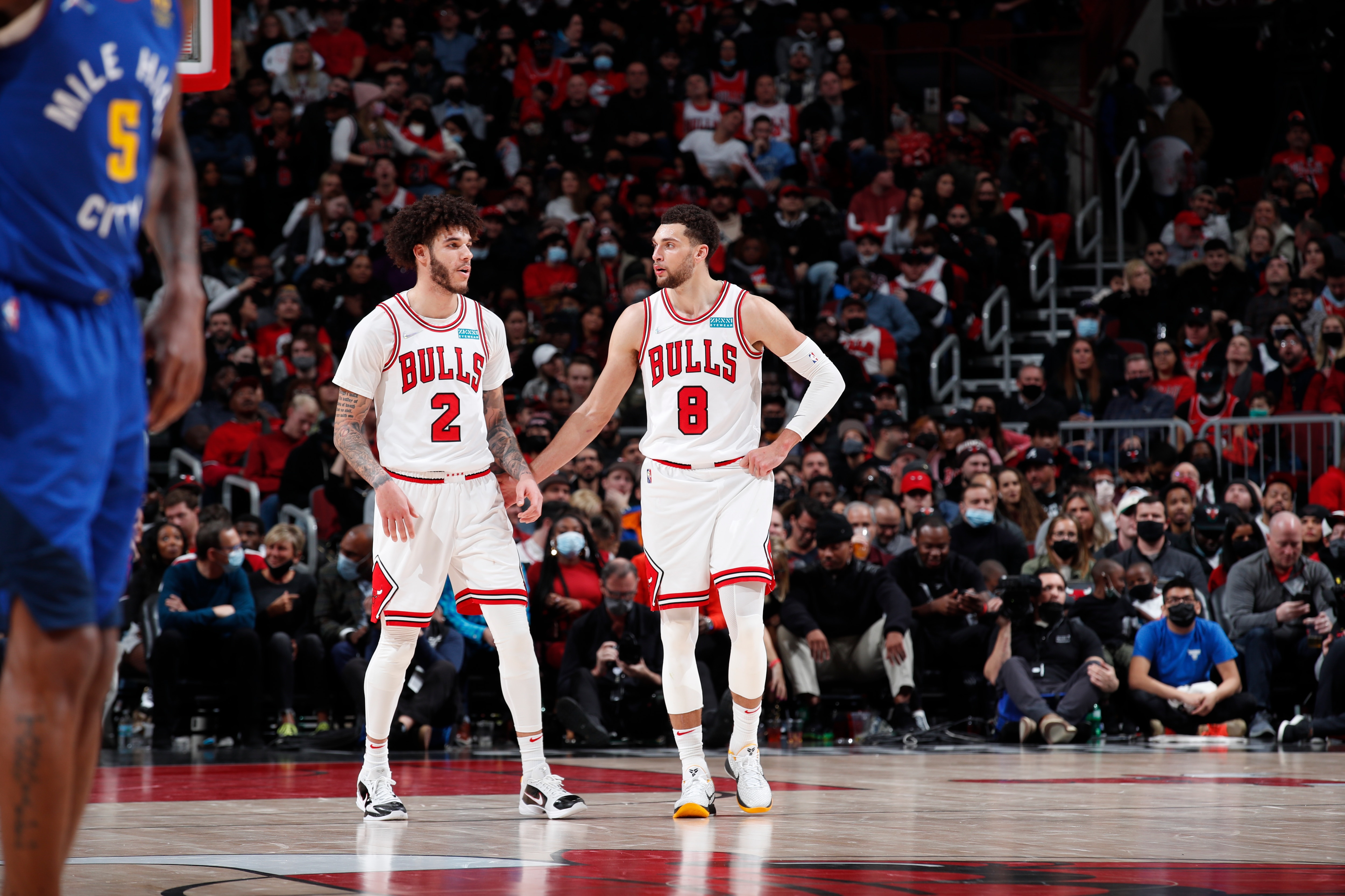 CHICAGO, IL - DECEMBER 6: Lonzo Ball #2 of the Chicago Bulls talks to Zach LaVine #8 of the Chicago Bulls during the game against the Denver Nuggets on December 6, 2021 at United Center in Chicago, Illinois. NOTE TO USER: User expressly acknowledges and agrees that, by downloading and or using this photograph, User is consenting to the terms and conditions of the Getty Images License Agreement. Mandatory Copyright Notice: Copyright 2021 NBAE (Photo by Jeff Haynes/NBAE via Getty Images)