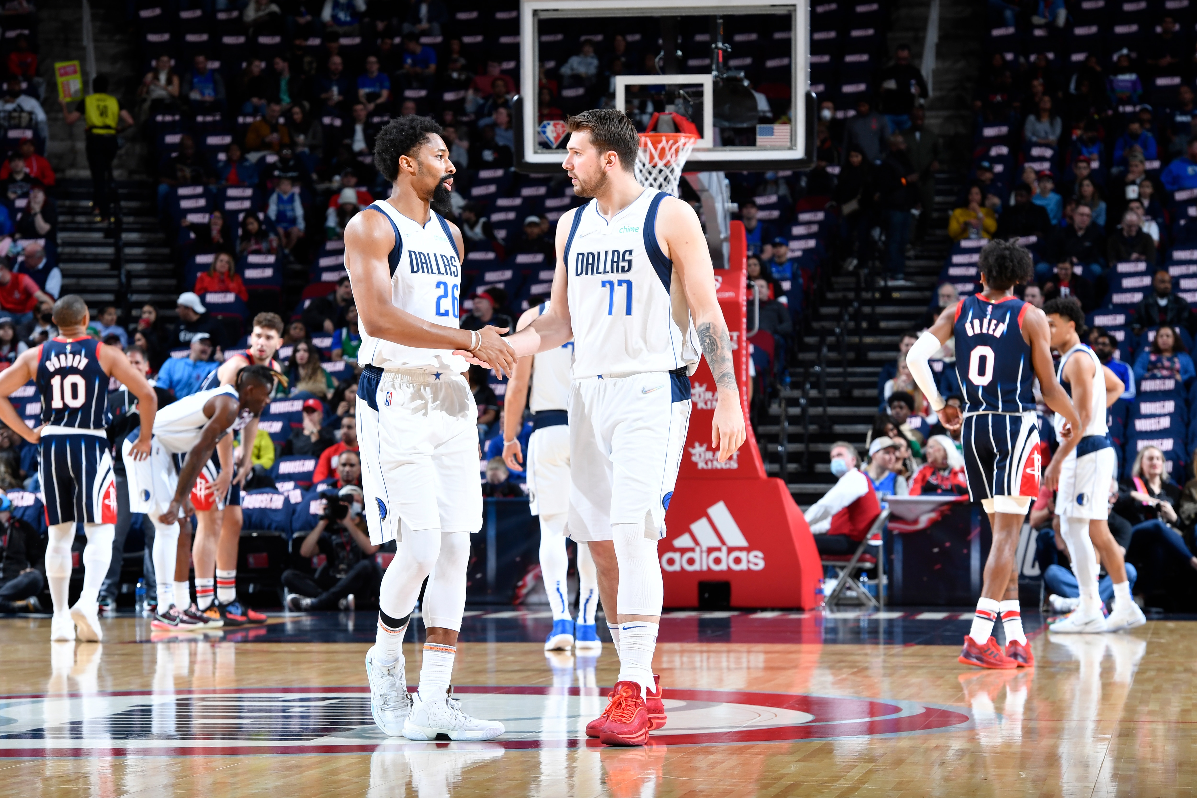 HOUSTON, TX - MARCH 11:  Spencer Dinwiddie #26 and Luka Doncic #77 of the Dallas Mavericks shake hands drives to the basket during the game against the Houston Rockets on March 11, 2022 at the Toyota Center in Houston, Texas. NOTE TO USER: User expressly acknowledges and agrees that, by downloading and or using this photograph, User is consenting to the terms and conditions of the Getty Images License Agreement. Mandatory Copyright Notice: Copyright 2022 NBAE (Photo by Logan Riely/NBAE via Getty Images)