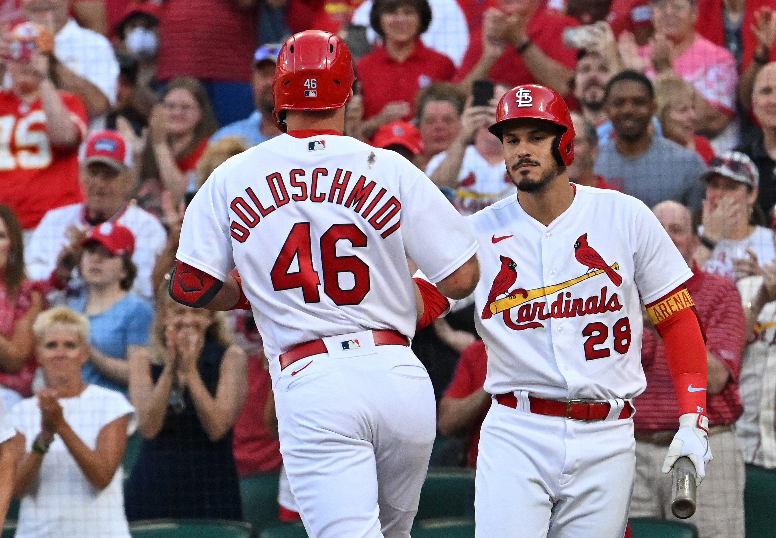 ST. LOUIS, MO - JUNE 27: St. Louis Cardinals third baseman Nolan Arenado (28) congratulates St. Louis Cardinals first baseman Paul Goldschmidt (46) at home plate after his solo home run during a MLB game between the Miami Marlins and the St. Louis Cardinals on June 27, 2022, at Busch Stadium, St. Louis, MO.  (Photo by Keith Gillett/Icon Sportswire via Getty Images),