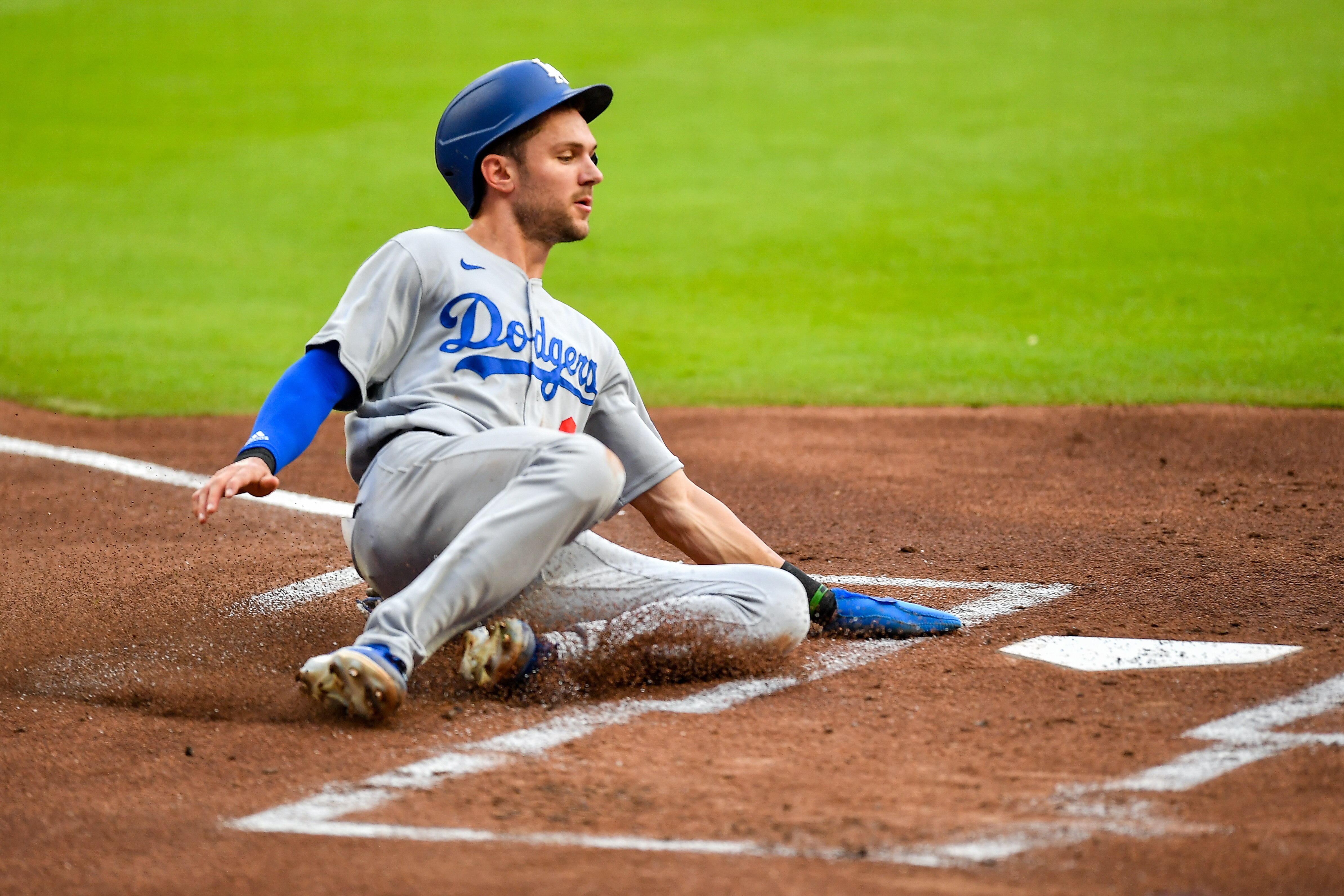ATLANTA, GA  JUNE 24:  Los Angeles shortstop Trea Turner (6) slides safely into home during the MLB game between the Los Angeles Dodgers and the Atlanta Braves on June 24th, 2022 at Truist Park in Atlanta, GA. (Photo by Rich von Biberstein/Icon Sportswire via Getty Images)
