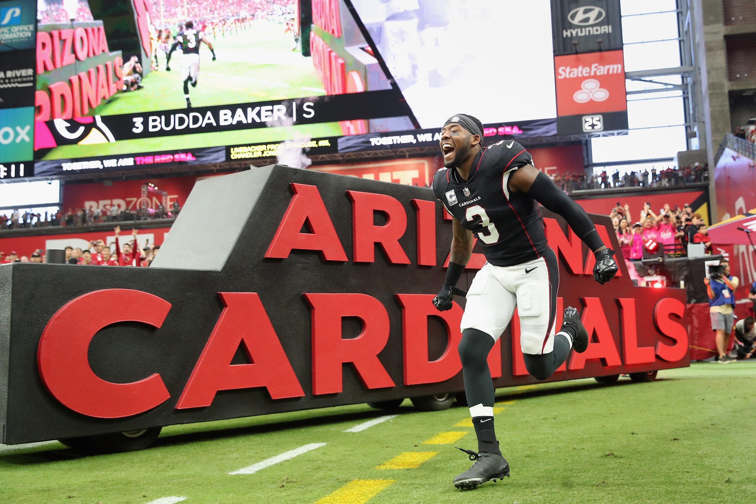 GLENDALE, ARIZONA - OCTOBER 10:  Safety Budda Baker #3 of the Arizona Cardinals runs onto the field before the NFL game at State Farm Stadium on October 10, 2021 in Glendale, Arizona. The Cardinals defeated the 49ers 17-10.  (Photo by Christian Petersen/Getty Images)