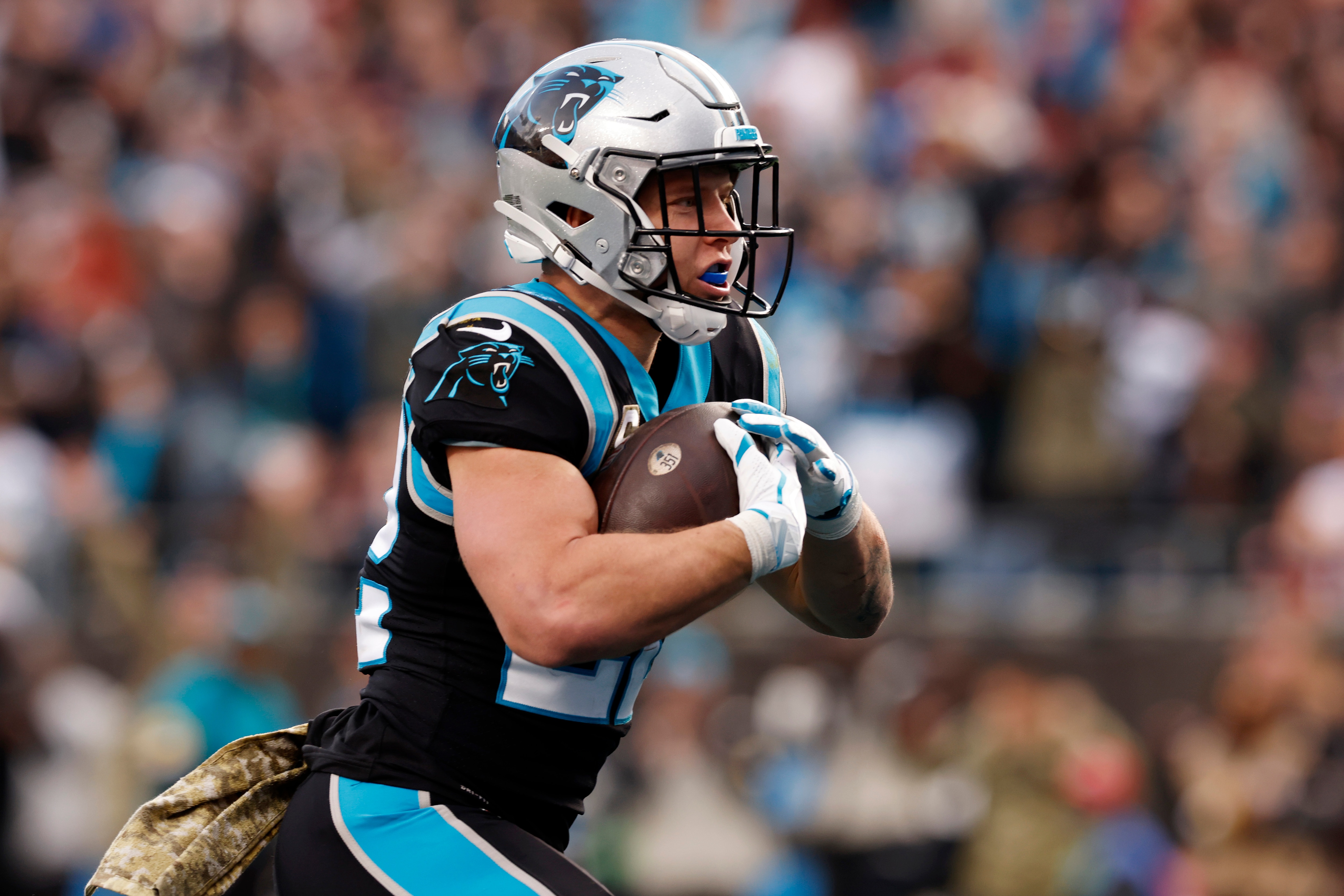 CHARLOTTE, NORTH CAROLINA - NOVEMBER 21: Christian McCaffrey #22 of the Carolina Panthers makes a 27-yard touchdown reception for a touchdown in the fourth quarter against the Washington Football Team at Bank of America Stadium on November 21, 2021 in Charlotte, North Carolina. (Photo by Grant Halverson/Getty Images)