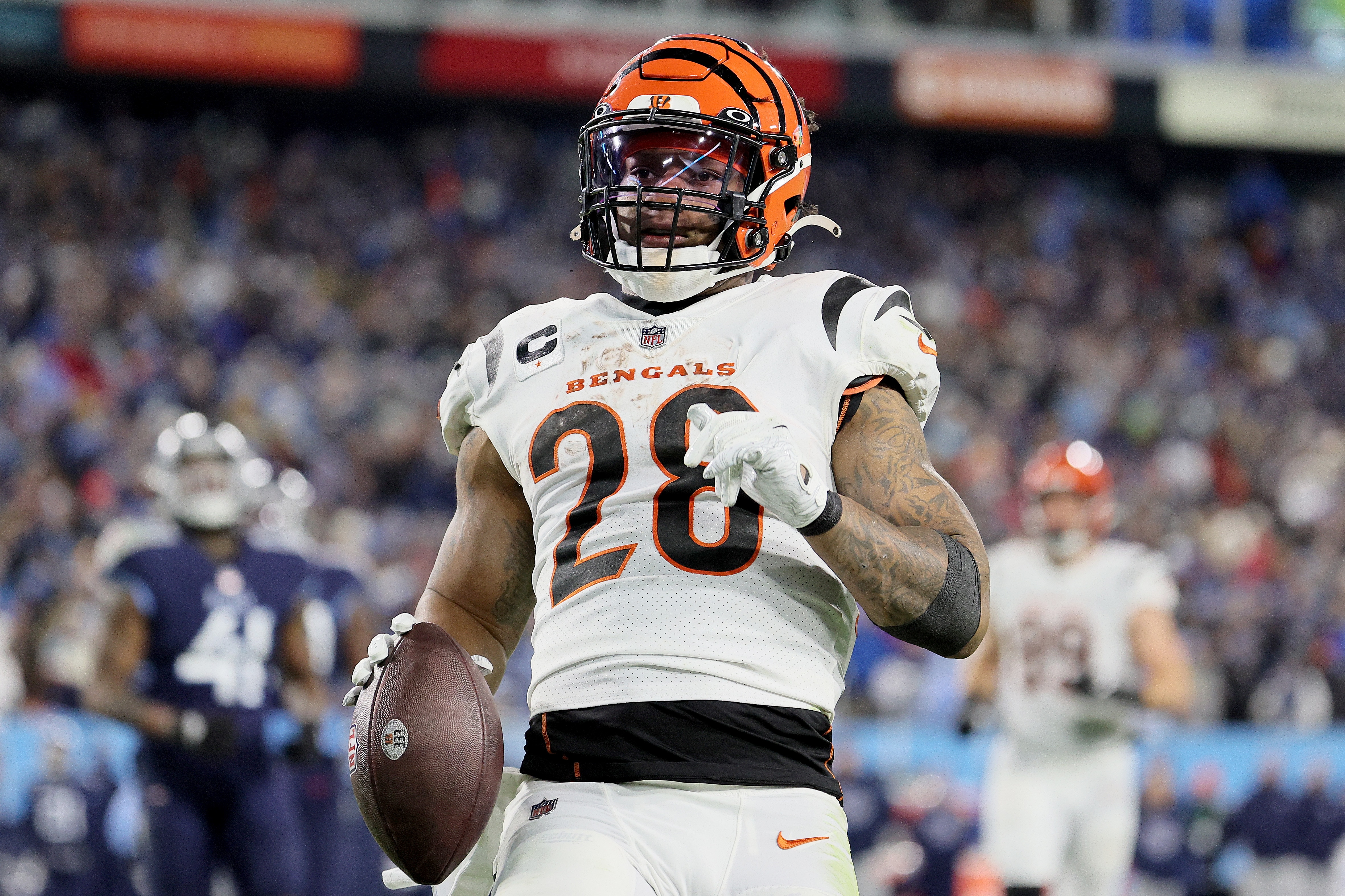 NASHVILLE, TENNESSEE - JANUARY 22: Running back Joe Mixon #28 of the Cincinnati Bengals rushes for a third quarter touchdown against the Tennessee Titans during the AFC Divisional Playoff game at Nissan Stadium on January 22, 2022 in Nashville, Tennessee. (Photo by Andy Lyons/Getty Images)