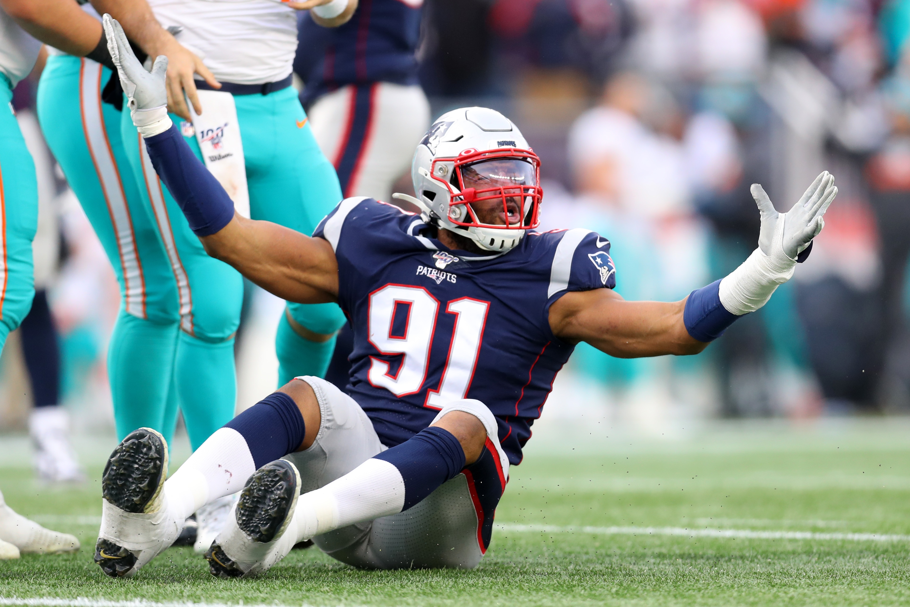 FOXBOROUGH, MASSACHUSETTS - DECEMBER 29: Deatrich Wise #91 of the New England Patriots reacts after a personal foul is called against him during the second half against the Miami Dolphins  at Gillette Stadium on December 29, 2019 in Foxborough, Massachusetts. (Photo by Maddie Meyer/Getty Images)