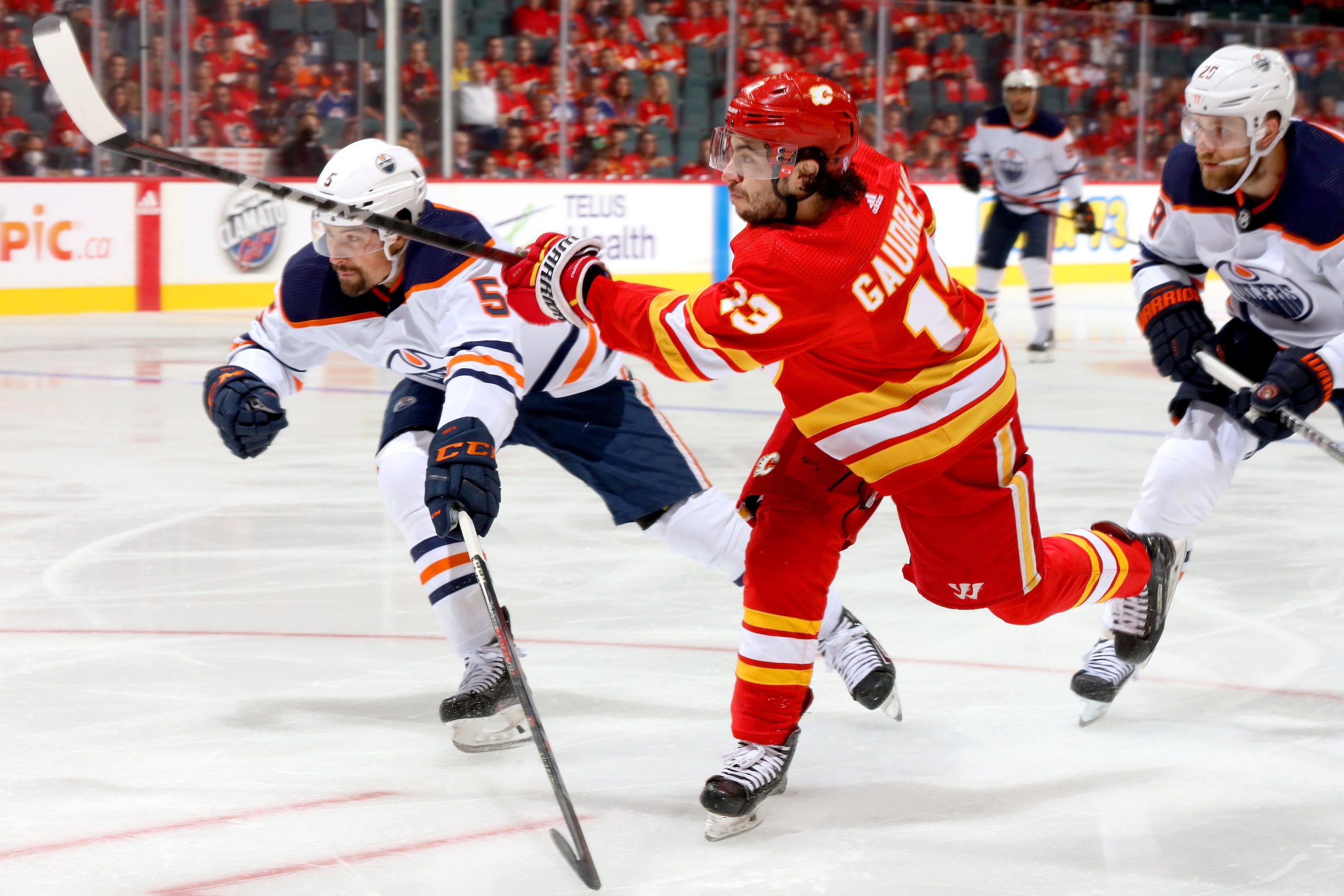 CALGARY, ALBERTA - MAY 26: Johnny Gaudreau #13 of the Calgary Flames skates against Cody Ceci #5 of the Edmonton Oilers in Game Five of the Second Round of the 2022 Stanley Cup Playoffs at Scotiabank Saddledome on May 26, 2022 in Calgary, Alberta. (Photo by Gerry Thomas/NHLI via Getty Images)