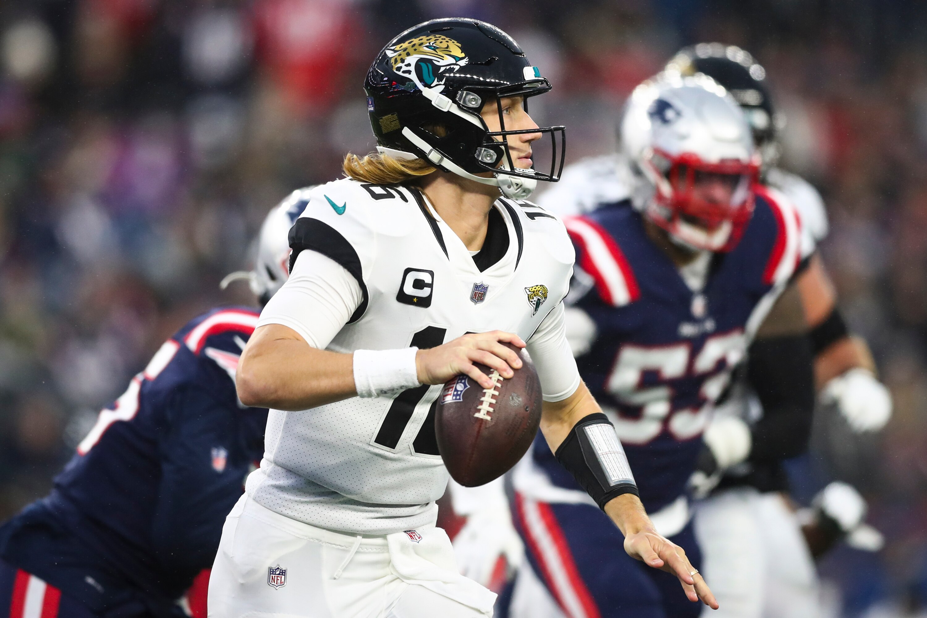 FOXBOROUGH, MASSACHUSETTS - JANUARY 02: Trevor Lawrence #16 of the Jacksonville Jaguars looks to pass the ball in the second quarter of the game against the New England Patriots at Gillette Stadium on January 02, 2022 in Foxborough, Massachusetts. (Photo by Adam Glanzman/Getty Images)