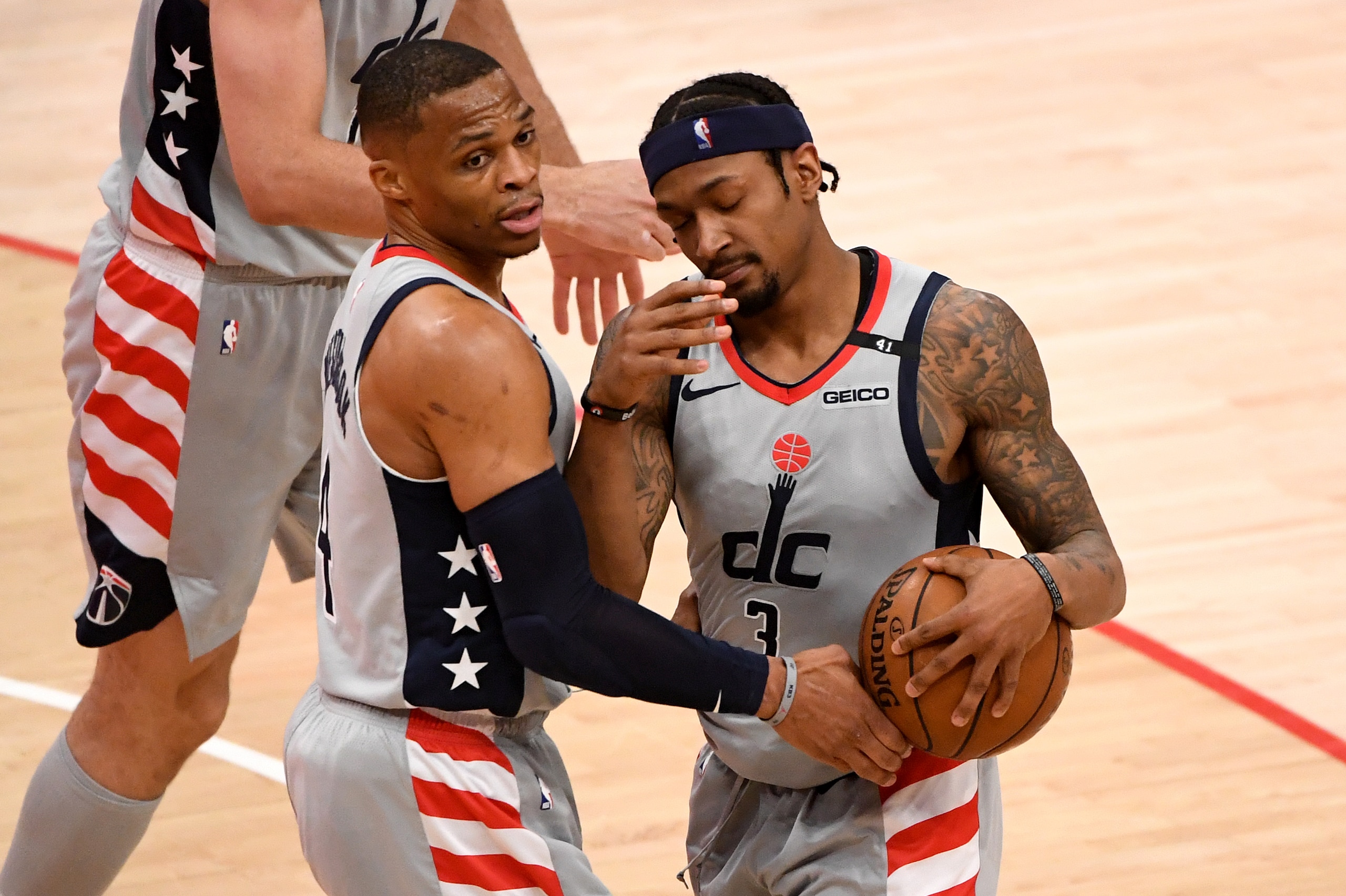 WASHINGTON, DC - APRIL 25: Russell Westbrook #4 and Bradley Beal #3 of the Washington Wizards react after a play against the Cleveland Cavaliers during the second half at Capital One Arena on April 25, 2021 in Washington, DC. NOTE TO USER: User expressly acknowledges and agrees that, by downloading and or using this photograph, User is consenting to the terms and conditions of the Getty Images License Agreement. (Photo by Will Newton/Getty Images)