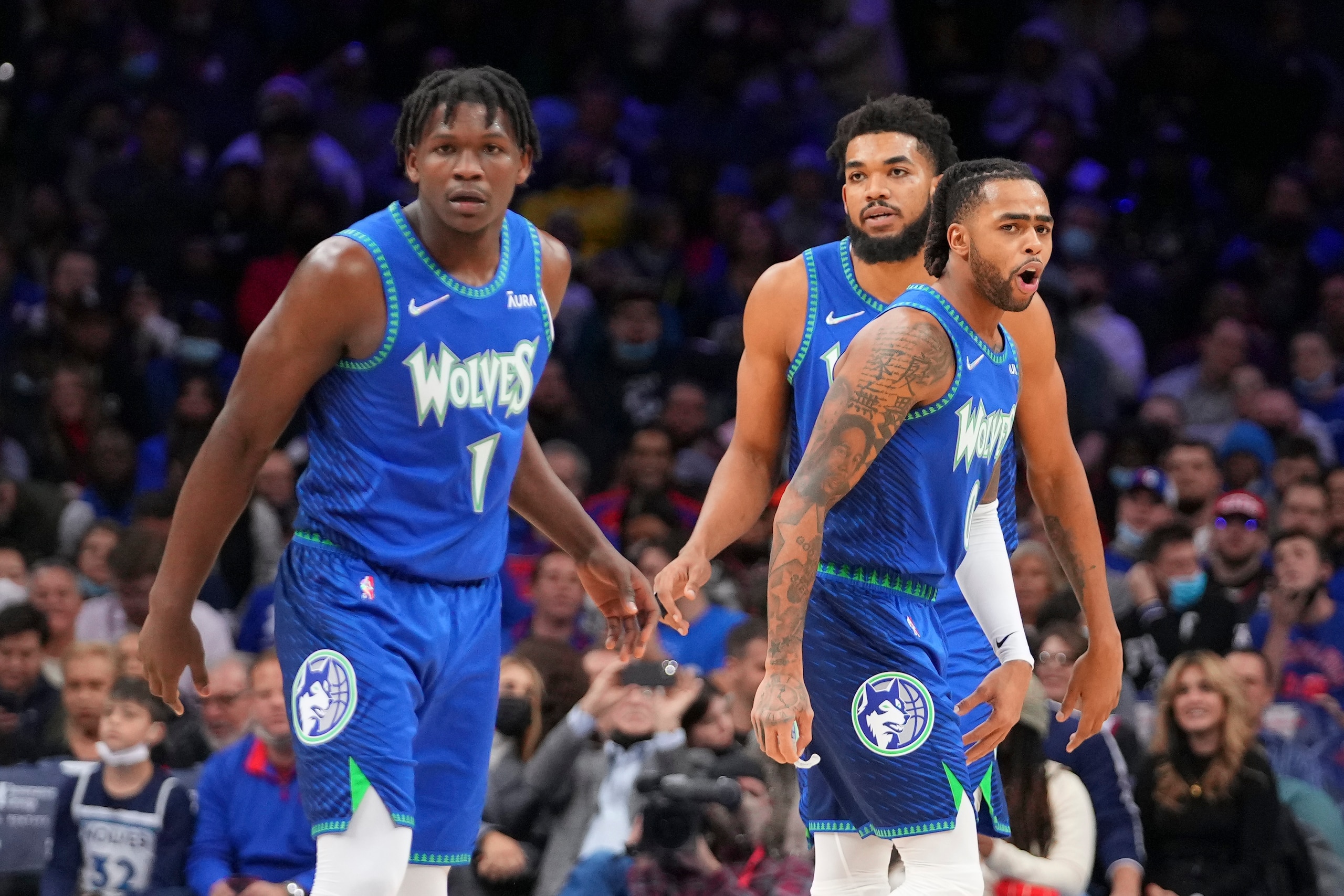PHILADELPHIA, PA - NOVEMBER 27: Anthony Edwards #1, D'Angelo Russell #0, and Karl-Anthony Towns #32 of the Minnesota Timberwolves look on against the Philadelphia 76ers at the Wells Fargo Center on November 27, 2021 in Philadelphia, Pennsylvania. The Timberwolves defeated the 76ers 121-120 in double overtime. NOTE TO USER: User expressly acknowledges and agrees that, by downloading and or using this photograph, User is consenting to the terms and conditions of the Getty Images License Agreement. (Photo by Mitchell Leff/Getty Images)