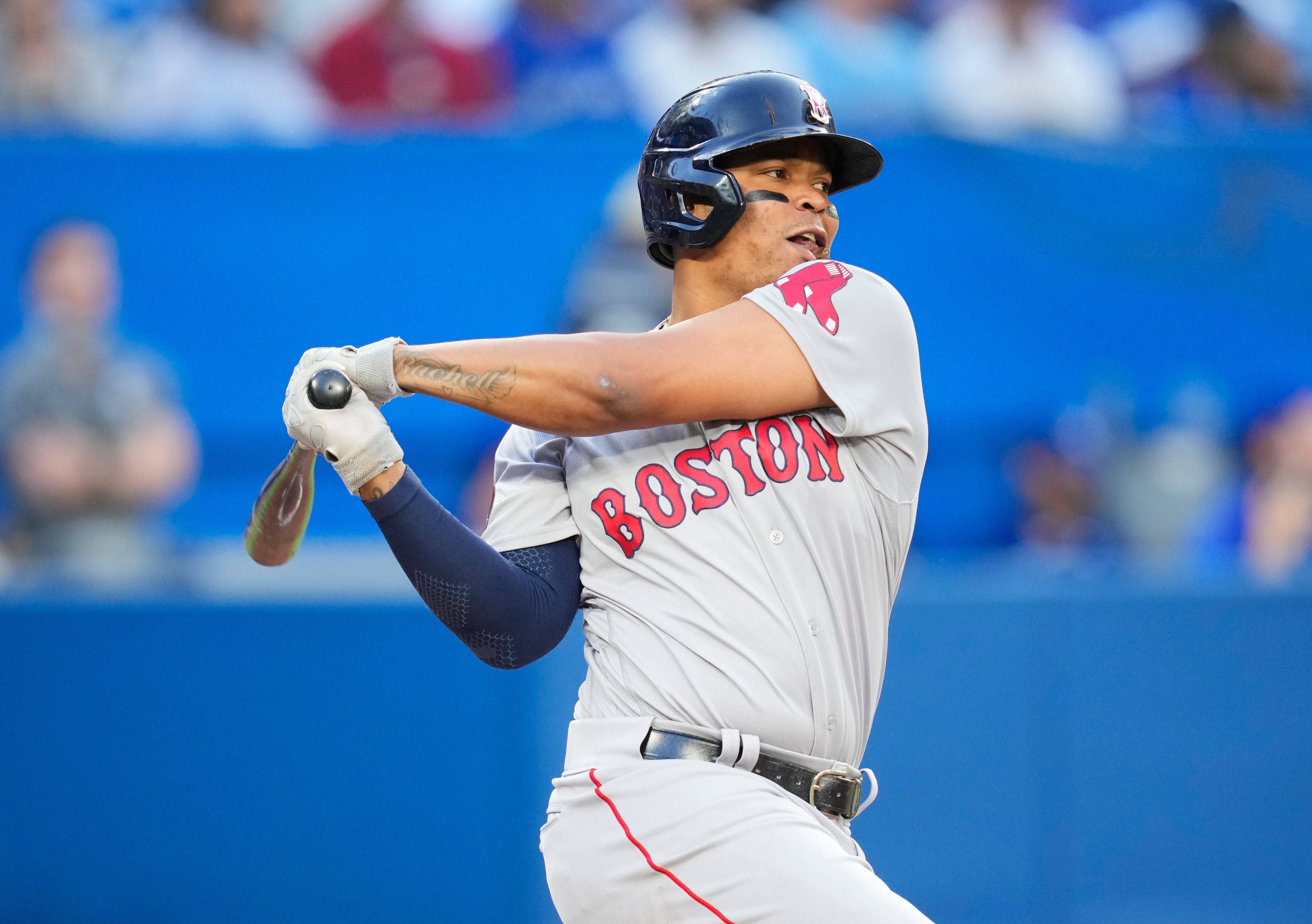TORONTO, ON - JUNE 28: Rafael Devers #11 of the Boston Red Sox swings against the Toronto Blue Jays in the third inning during their MLB game at the Rogers Centre on June 28, 2022 in Toronto, Ontario, Canada. (Photo by Mark Blinch/Getty Images)