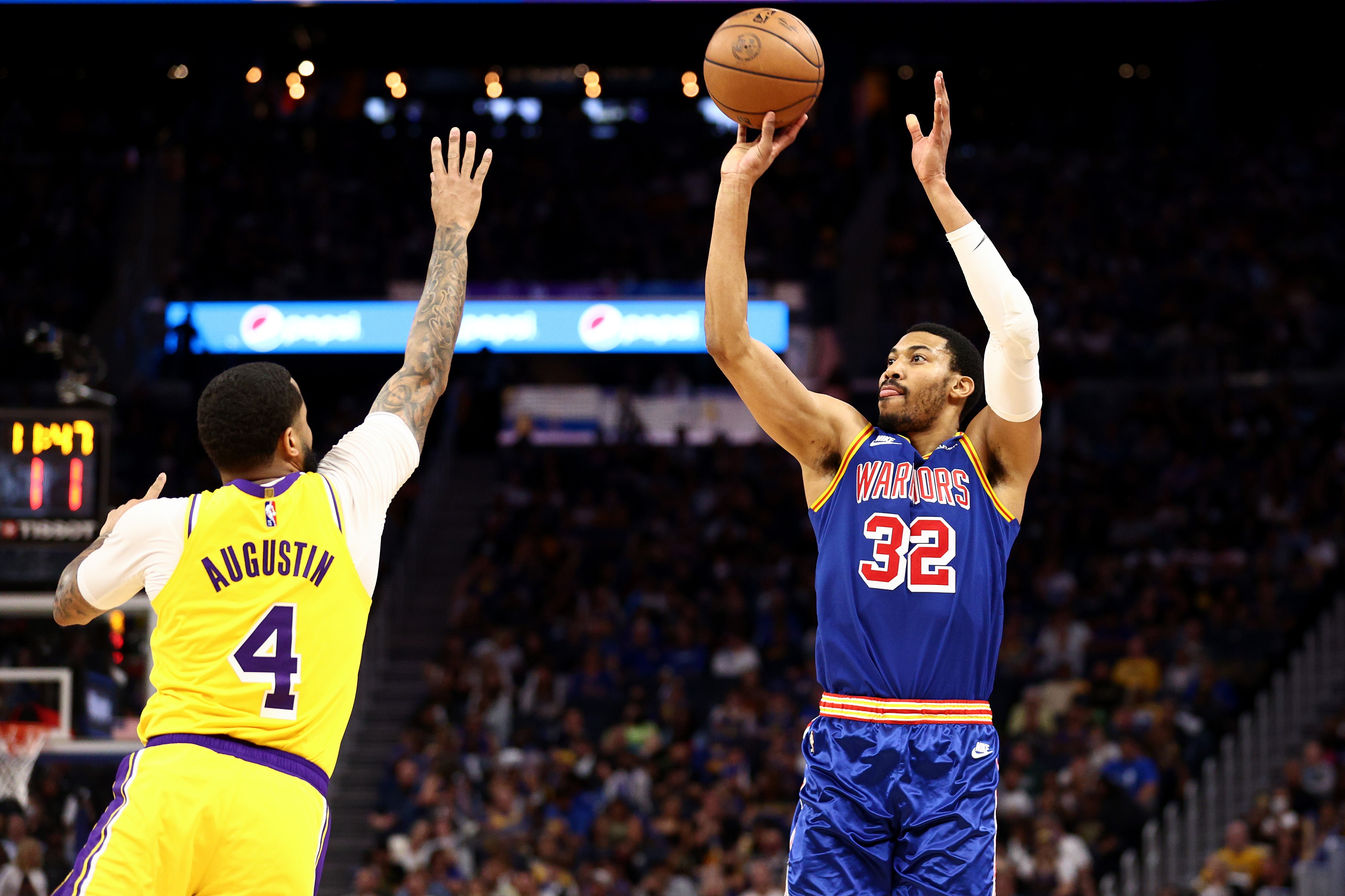 SAN FRANCISCO, CALIFORNIA - APRIL 07:  Otto Porter Jr. #32 of the Golden State Warriors shoots over D.J. Augustin #4 of the Los Angeles Lakers in the second half at Chase Center on April 07, 2022 in San Francisco, California. NOTE TO USER: User expressly acknowledges and agrees that, by downloading and/or using this photograph, User is consenting to the terms and conditions of the Getty Images License Agreement.  (Photo by Ezra Shaw/Getty Images)