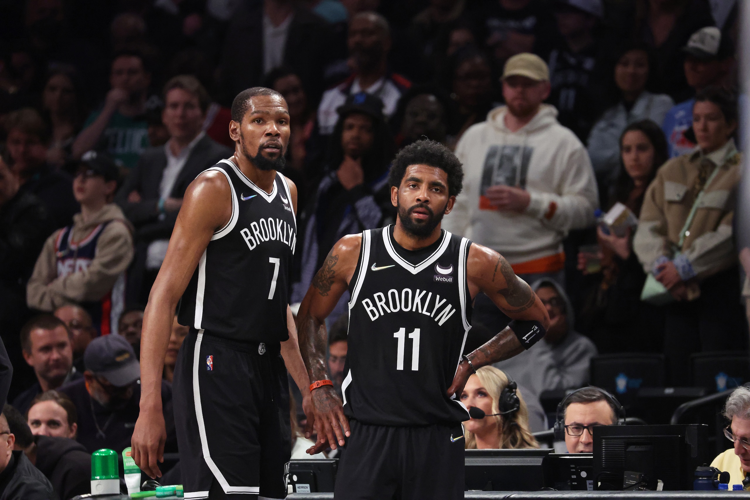 NEW YORK, NEW YORK - APRIL 23:  Kevin Durant #7 and Kyrie Irving #11 of the Brooklyn Nets look on in the final seconds of their 109-103 loss against the Boston Celtics during Game Three of the Eastern Conference First Round NBA Playoffs at Barclays Center on April 23, 2022 in New York City.  NOTE TO USER: User expressly acknowledges and agrees that, by downloading and or using this photograph, User is consenting to the terms and conditions of the Getty Images License Agreement.  (Photo by Al Bello/Getty Images).