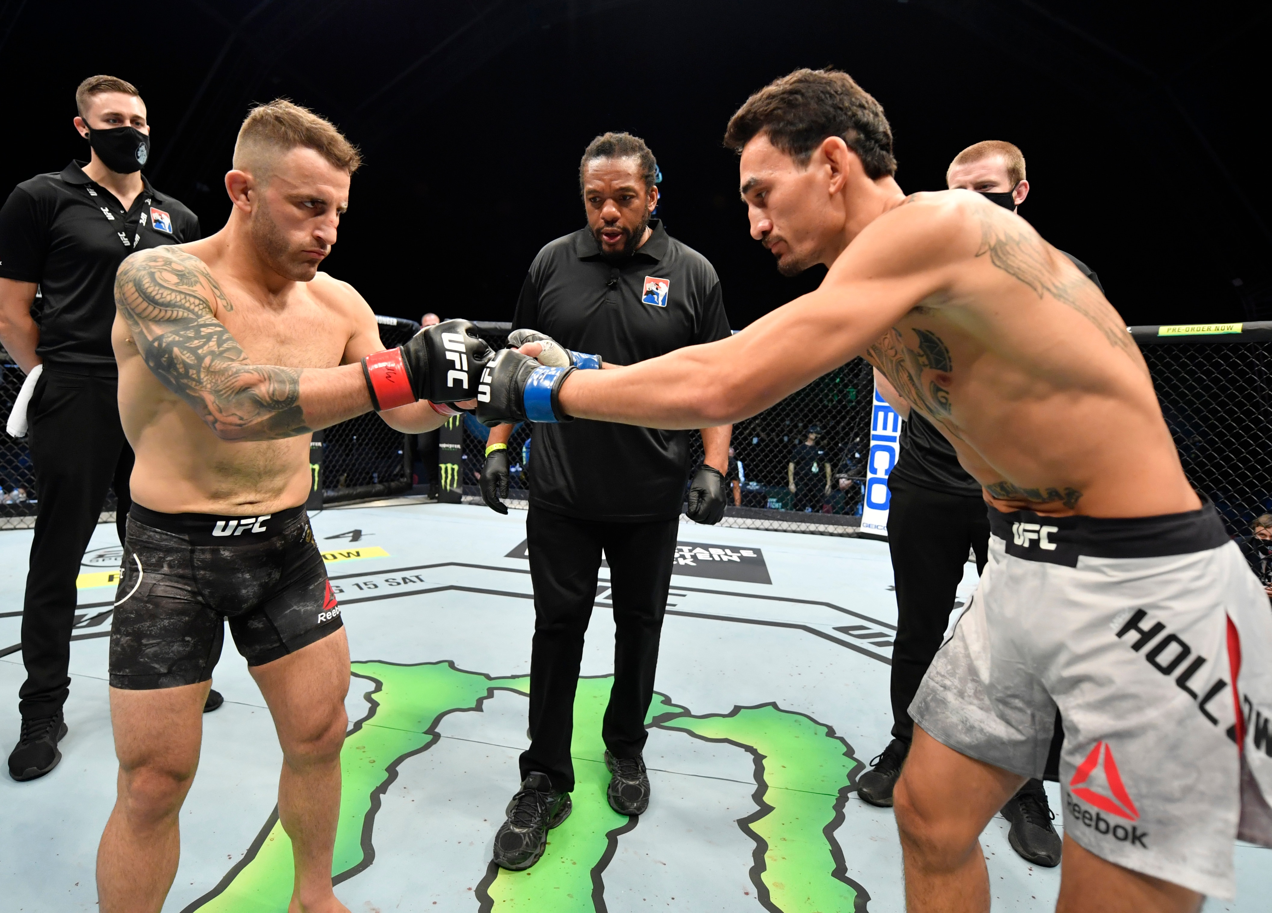 ABU DHABI, UNITED ARAB EMIRATES - JULY 12: (L-R) Opponents Alexander Volkanovski of Australia and Max Holloway face off prior to their UFC featherweight championship fight during the UFC 251 event at Flash Forum on UFC Fight Island on July 12, 2020 on Yas Island, Abu Dhabi, United Arab Emirates. (Photo by Jeff Bottari/Zuffa LLC)