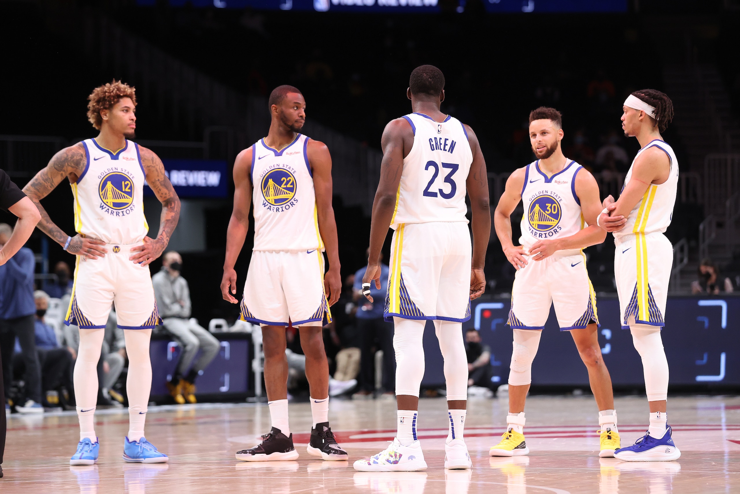 ATLANTA, GA - APRIL 4: Draymond Green #23 of the Golden State Warriors talks with Kelly Oubre Jr. #12, Andrew Wiggins #22, Stephen Curry #30, and Damion Lee #1 during the game against the Atlanta Hawks on April 4, 2021 at State Farm Arena in Atlanta, Georgia.  NOTE TO USER: User expressly acknowledges and agrees that, by downloading and/or using this Photograph, user is consenting to the terms and conditions of the Getty Images License Agreement. Mandatory Copyright Notice: Copyright 2021 NBAE (Photo by Joe Murphy/NBAE via Getty Images)