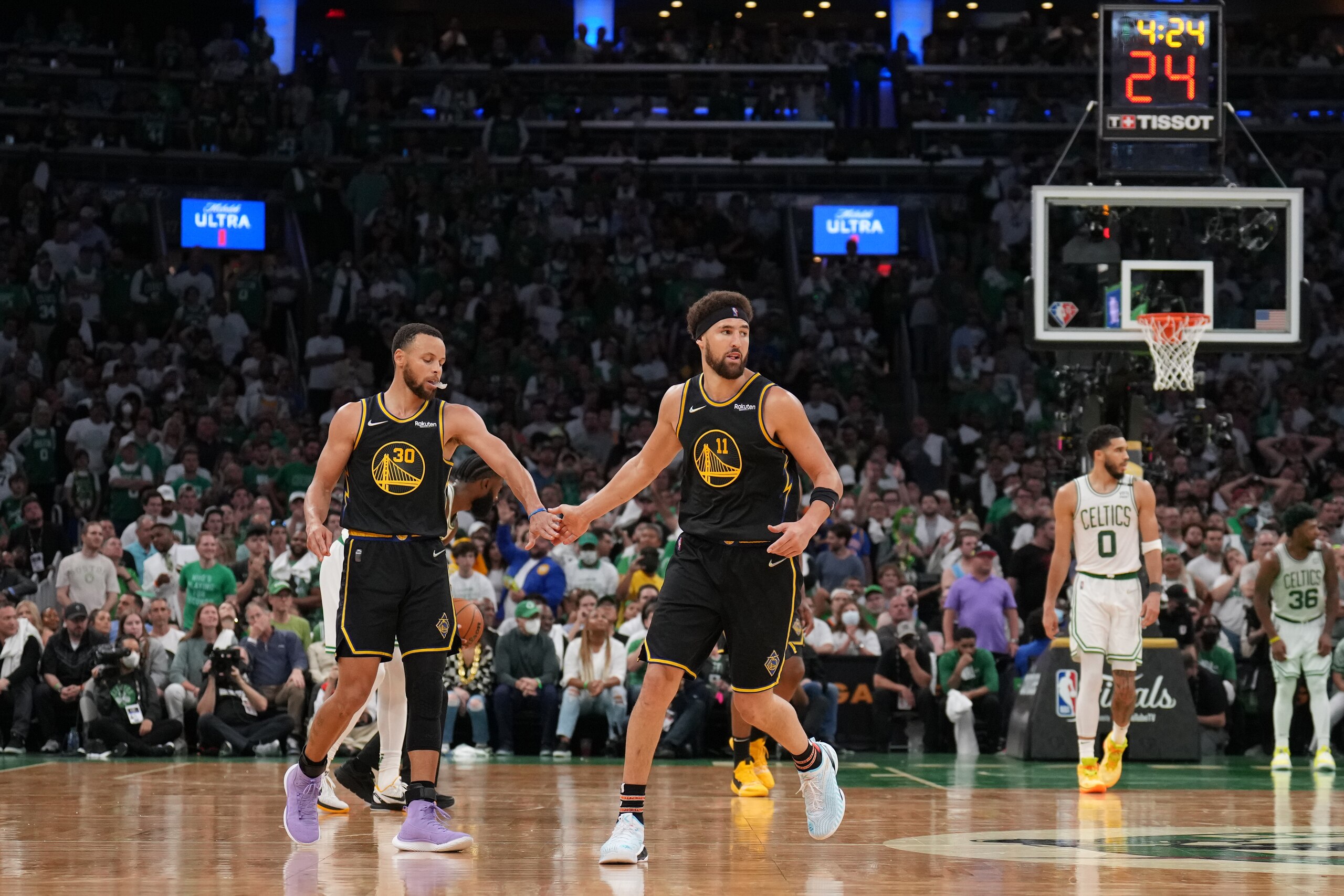 BOSTON, MA - JUNE 10: Stephen Curry #30 of the Golden State Warriors high fives Klay Thompson #11 of the Golden State Warriors during Game Four of the 2022 NBA Finals on June 10, 2022 at TD Garden in Boston, Massachusetts. NOTE TO USER: User expressly acknowledges and agrees that, by downloading and or using this photograph, user is consenting to the terms and conditions of Getty Images License Agreement. Mandatory Copyright Notice: Copyright 2022 NBAE (Photo by Jesse D. GarrabrantNBAE via Getty Images)