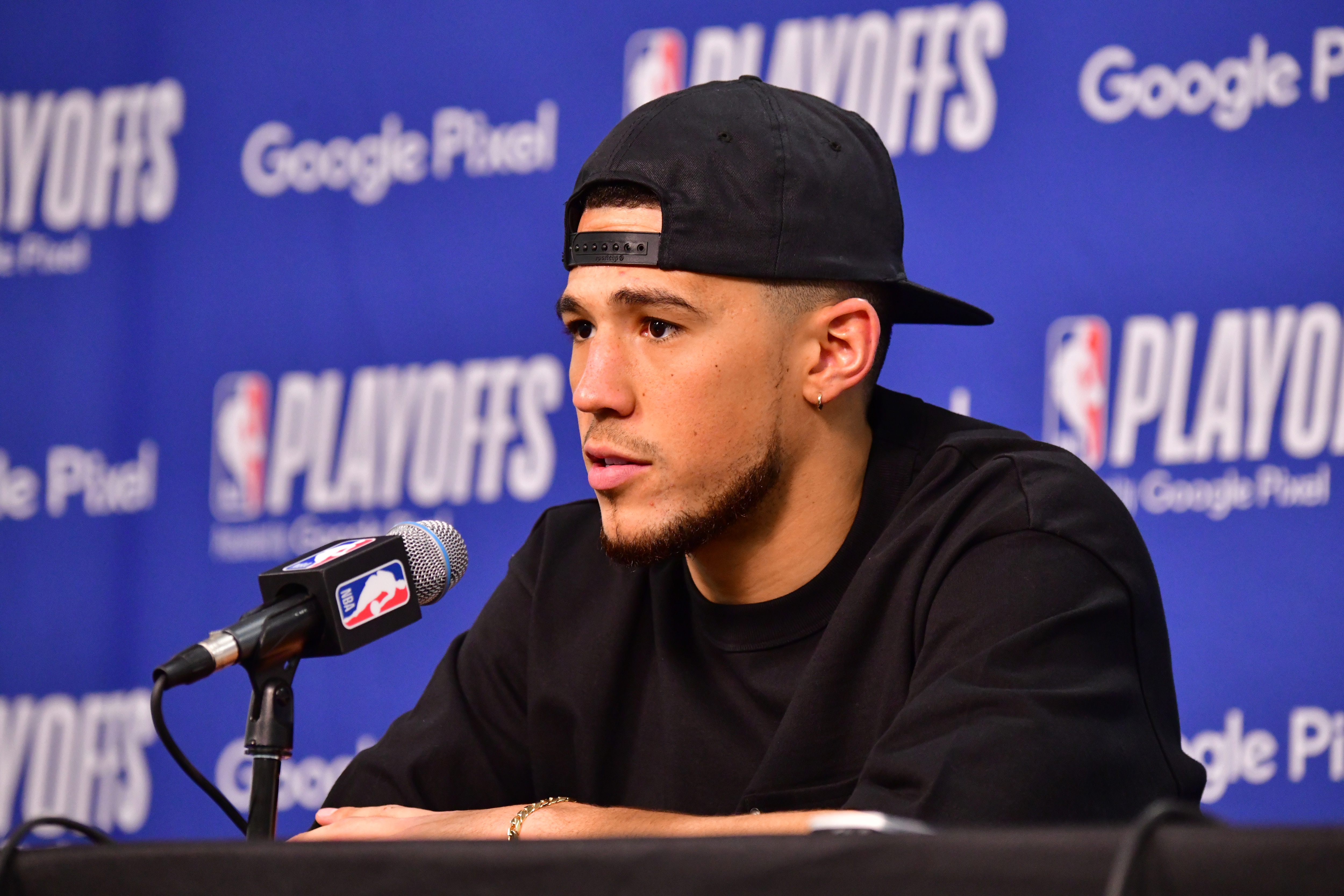 PHOENIX, AZ - MAY 15: Devin Booker #1 of the Phoenix Suns talks to the media after Game 7 of the 2022 NBA Playoffs Western Conference Semifinals on May 15, 2022 at Footprint Center in Phoenix, Arizona. NOTE TO USER: User expressly acknowledges and agrees that, by downloading and or using this photograph, user is consenting to the terms and conditions of the Getty Images License Agreement. Mandatory Copyright Notice: Copyright 2022 NBAE (Photo by Barry Gossage/NBAE via Getty Images)