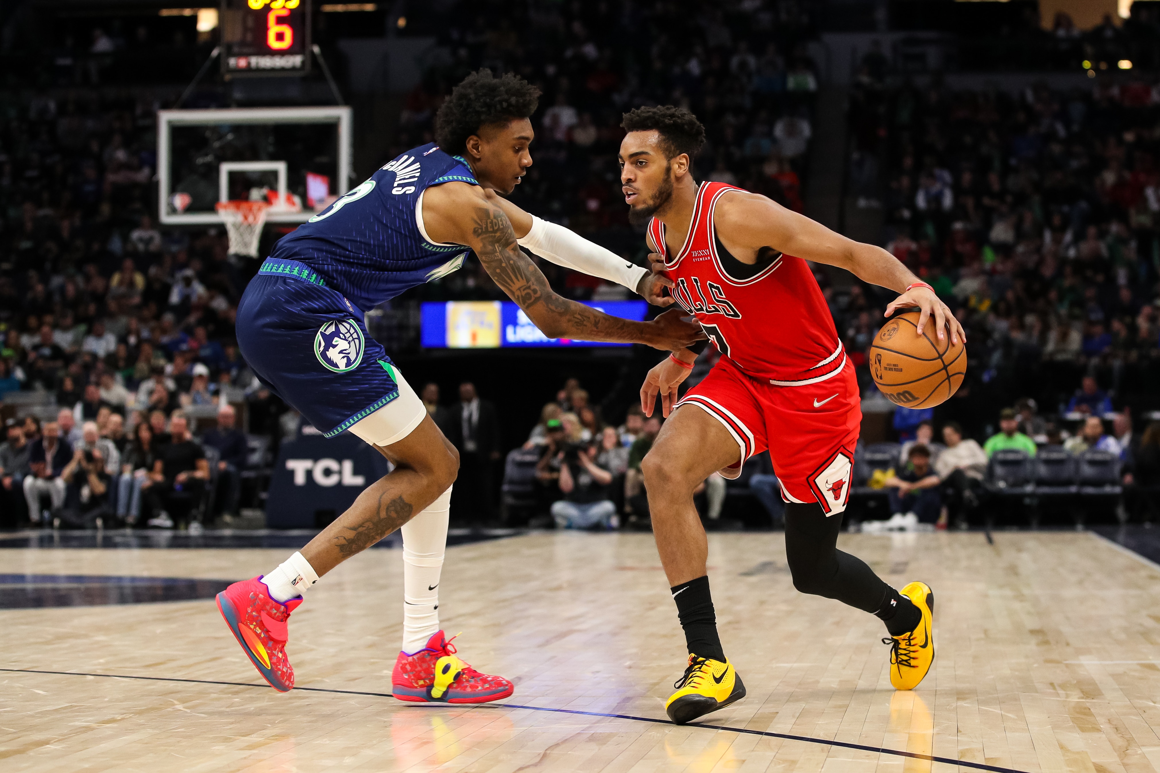 MINNEAPOLIS, MN - APRIL 10: Troy Brown Jr. #7 of the Chicago Bulls controls the ball against Jaden McDaniels #3 of the Minnesota Timberwolves in the third quarter at Target Center on April 10, 2022 in Minneapolis, Minnesota. The Bulls defeated the Timberwolves 124-120. NOTE TO USER: User expressly acknowledges and agrees that, by downloading and or using this Photograph, user is consenting to the terms and conditions of the Getty Images License Agreement. (Photo by David Berding/Getty Images)