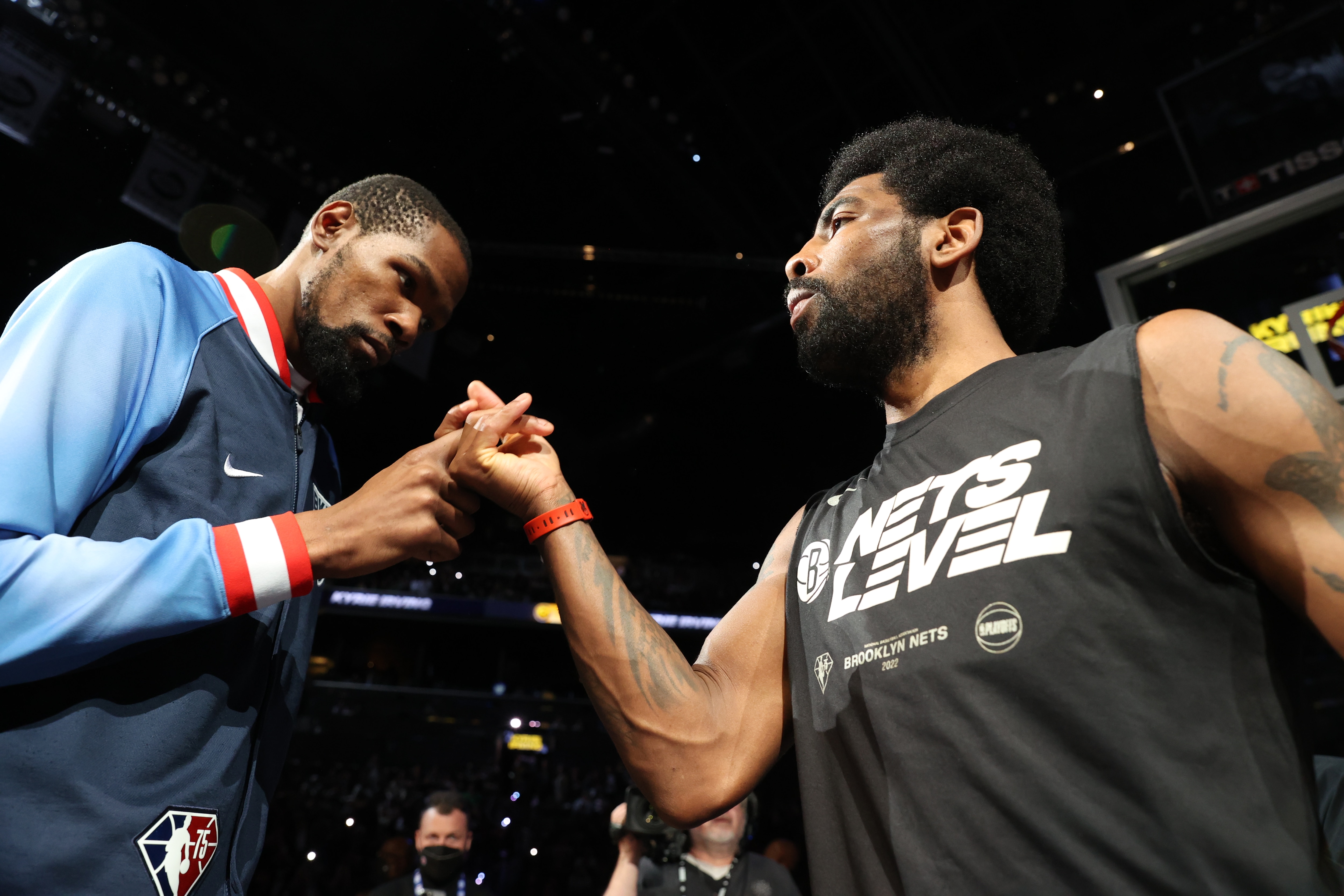 BROOKLYN, NY - APRIL 25: Kevin Durant #7 hi-fives Kyrie Irving #11 of the Brooklyn Nets before Round 1 Game 4 of the 2022 NBA Playoffs on April 25, 2022 at Barclays Center in Brooklyn, New York. NOTE TO USER: User expressly acknowledges and agrees that, by downloading and or using this Photograph, user is consenting to the terms and conditions of the Getty Images License Agreement. Mandatory Copyright Notice: Copyright 2022 NBAE (Photo by Nathaniel S. Butler/NBAE via Getty Images)