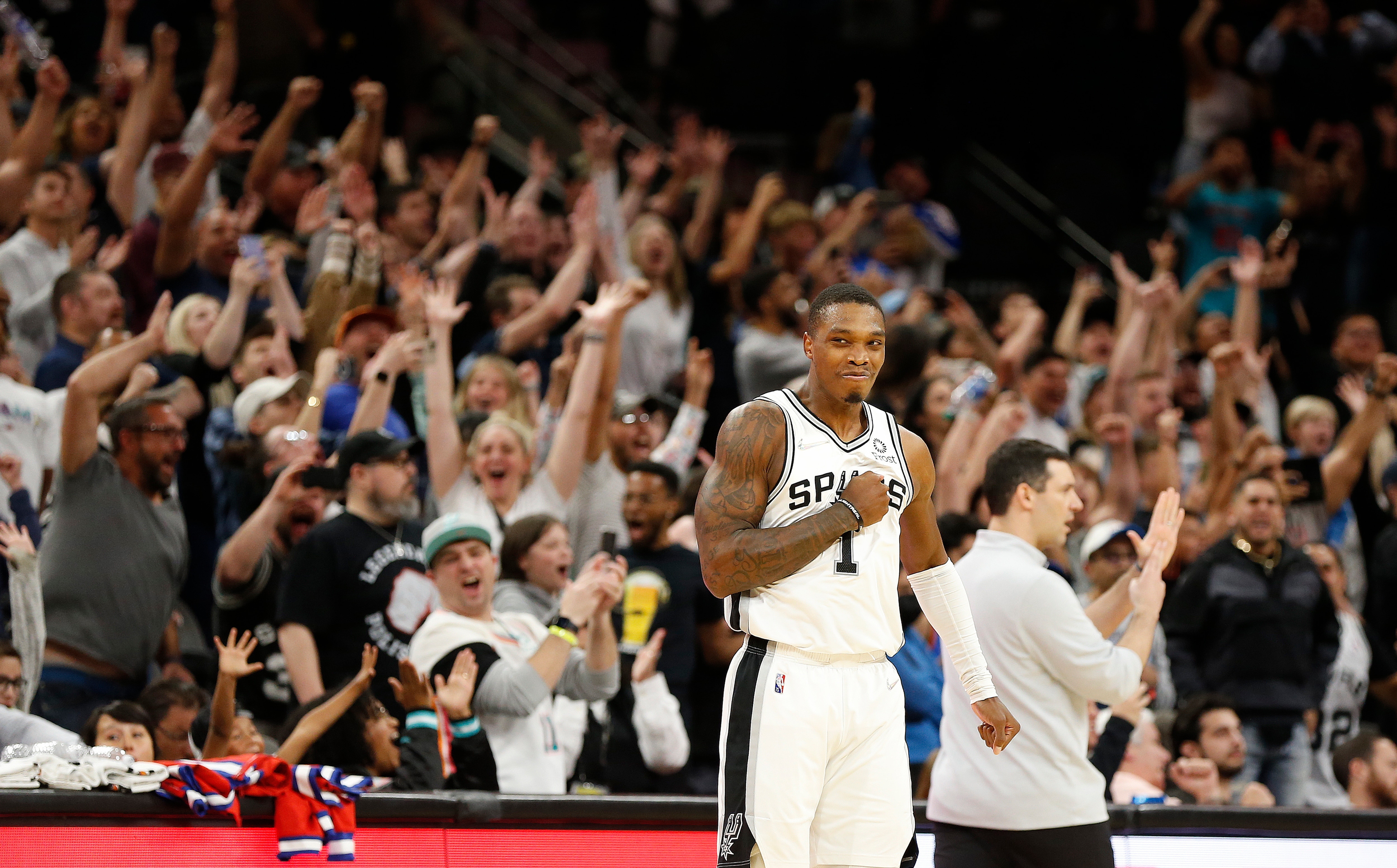 SAN ANTONIO, TX - MARCH 16:  Lonnie Walker #1 of the San Antonio Spurs reacts after making a three-point shot in the closing seconds of the second half at AT&T Center on March 16,  2022 in San Antonio, Texas. NOTE TO USER: User expressly acknowledges and agrees that, by downloading and or using this photograph, User is consenting to terms and conditions of the Getty Images License Agreement. (Photo by Ronald Cortes/Getty Images)