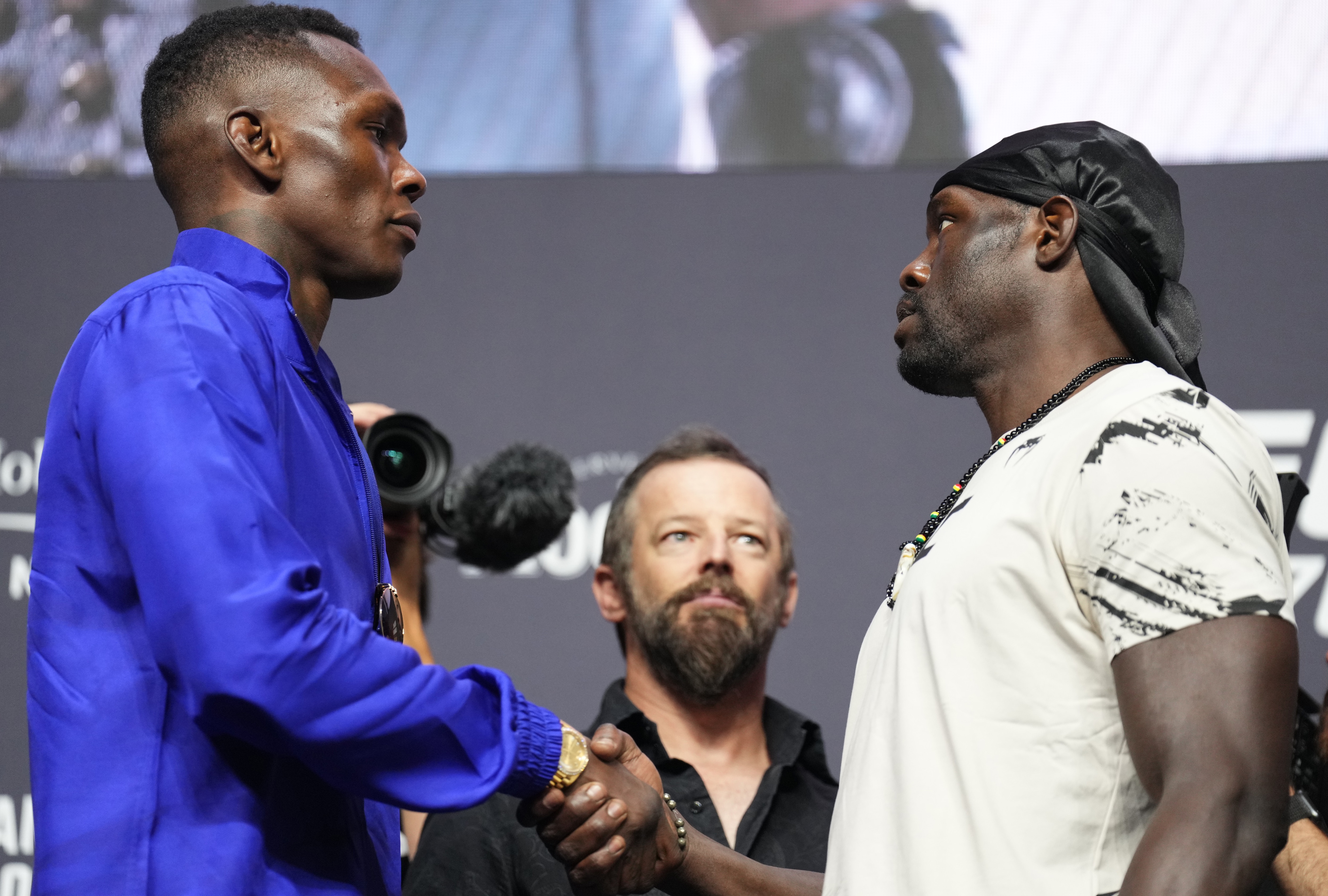 LAS VEGAS, NEVADA - JUNE 30: (L-R) Opponents Israel Adesanya of Nigeria and Jared Cannonier face off during the UFC 276 press conference at T-Mobile Arena on June 30, 2022 in Las Vegas, Nevada. (Photo by Chris Unger/Zuffa LLC)