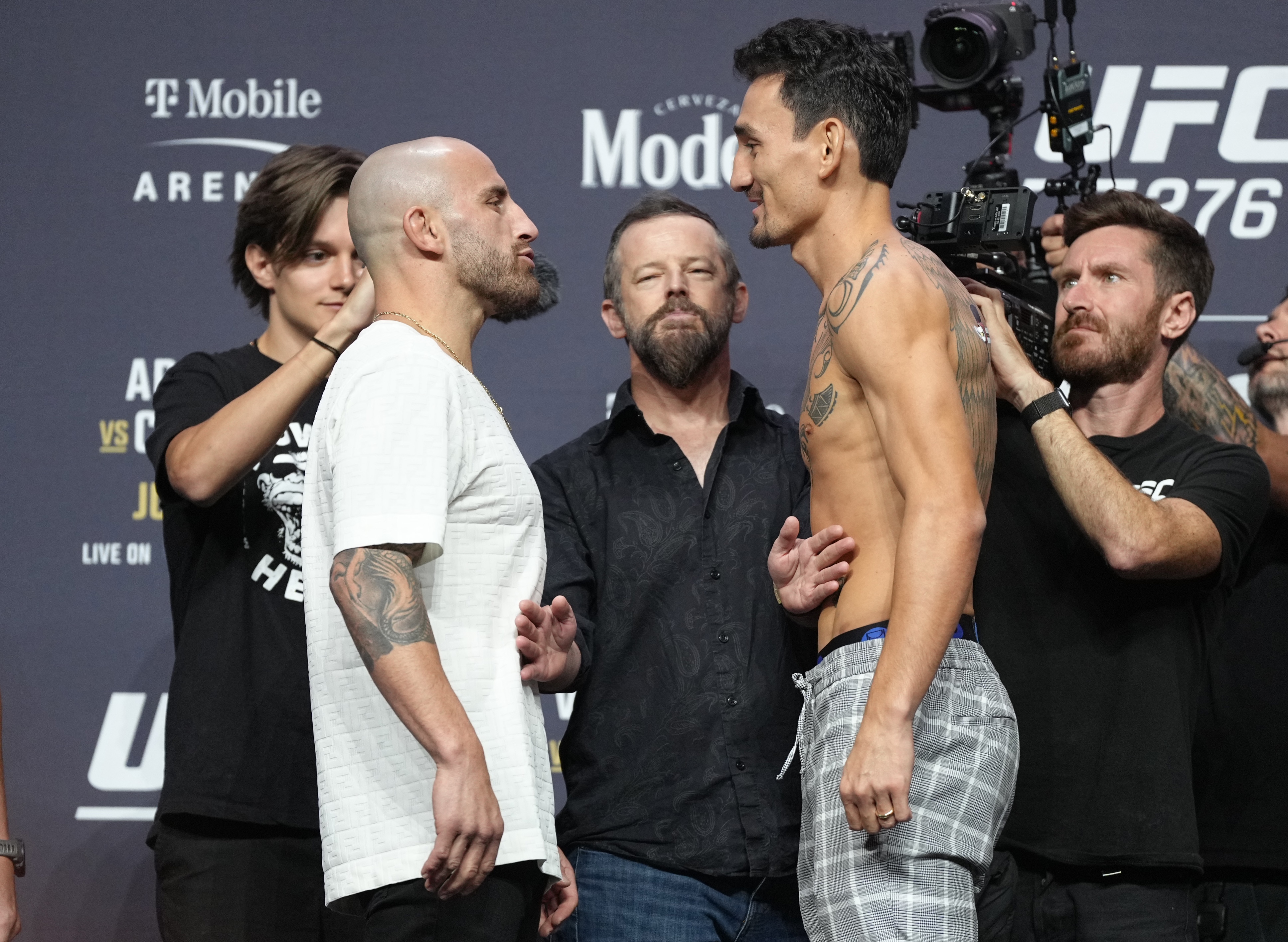 LAS VEGAS, NEVADA - JUNE 30: (L-R) Opponents Alexander Volkanovski of Australia and Max Holloway face off during the UFC 276 press conference at T-Mobile Arena on June 30, 2022 in Las Vegas, Nevada. (Photo by Jeff Bottari/Zuffa LLC)