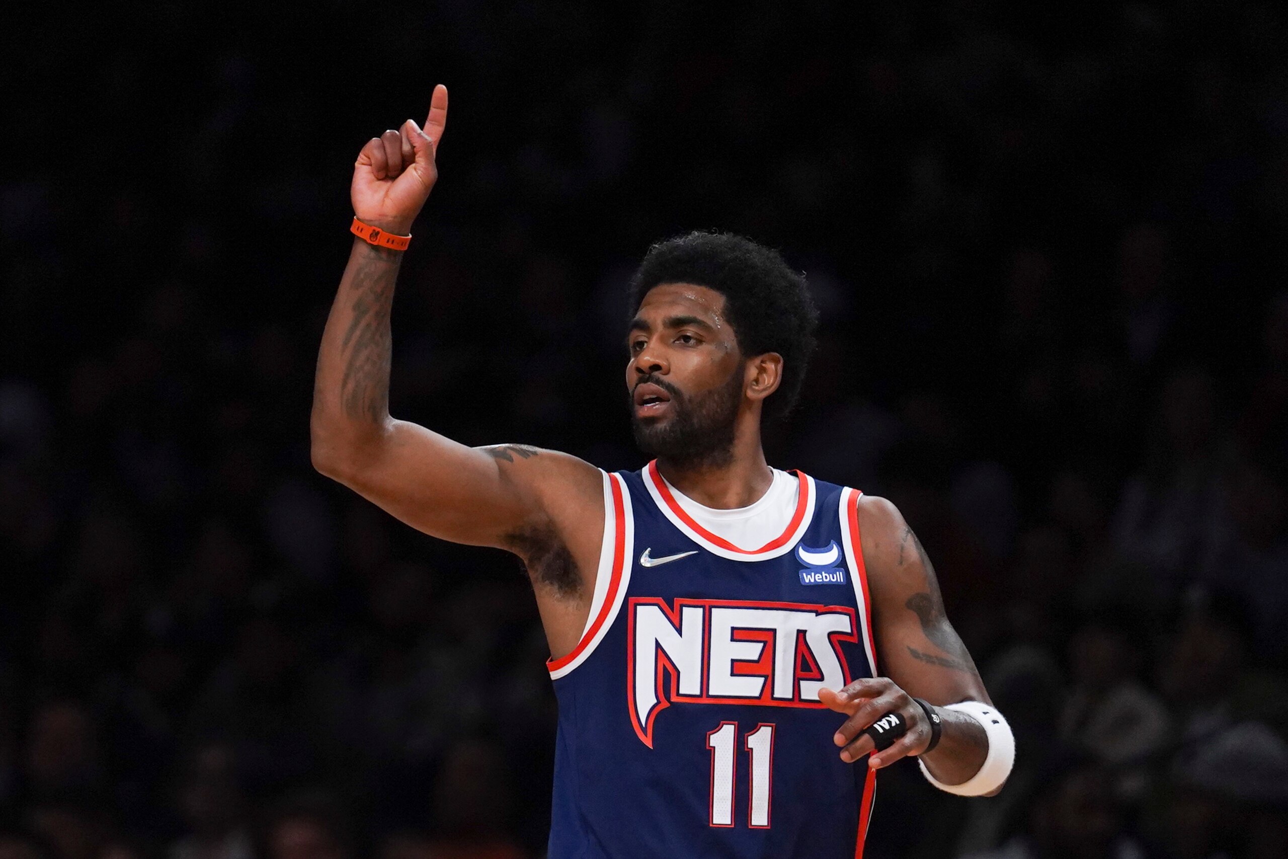 Brooklyn Nets guard Kyrie Irving (11) signals teammate during NBA game against Houston Rockets Tuesday April 5, 2022, in New York. (AP Photo/Bebeto Matthews)