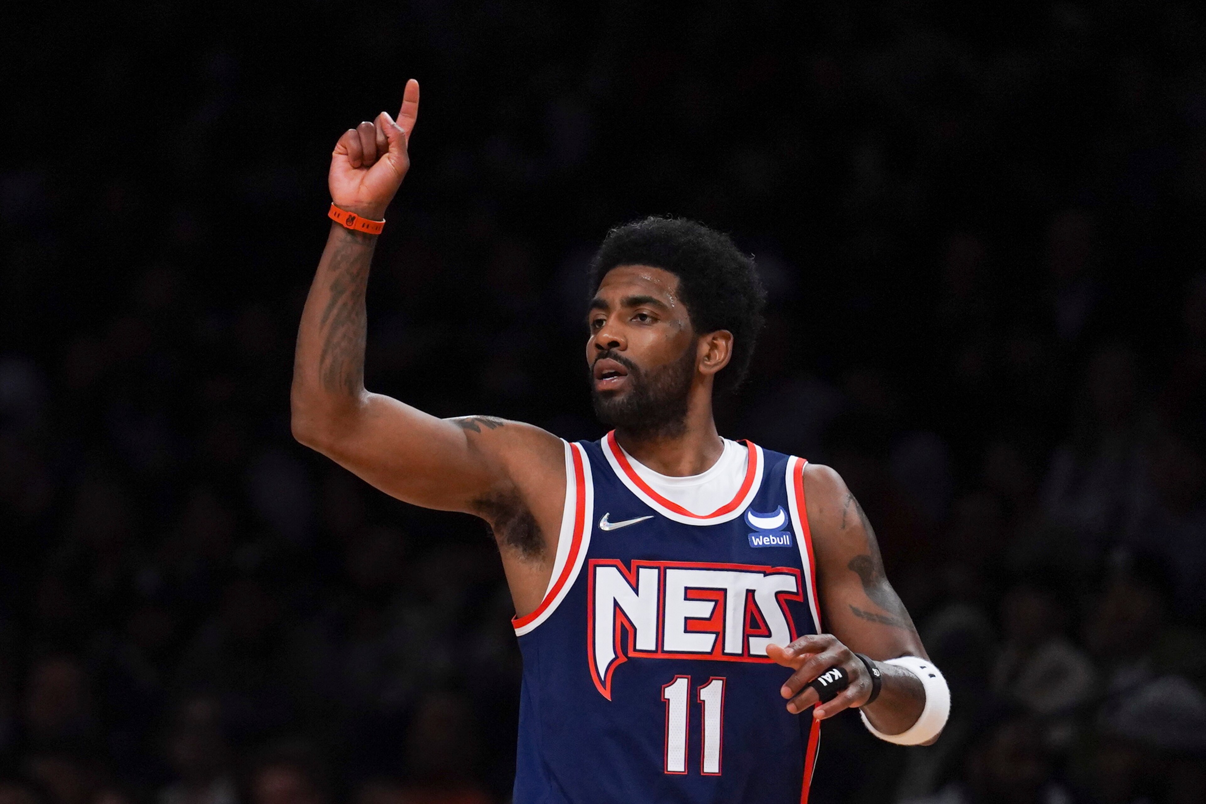 Brooklyn Nets guard Kyrie Irving (11) signals teammate during NBA game against Houston Rockets Tuesday April 5, 2022, in New York. (AP Photo/Bebeto Matthews)