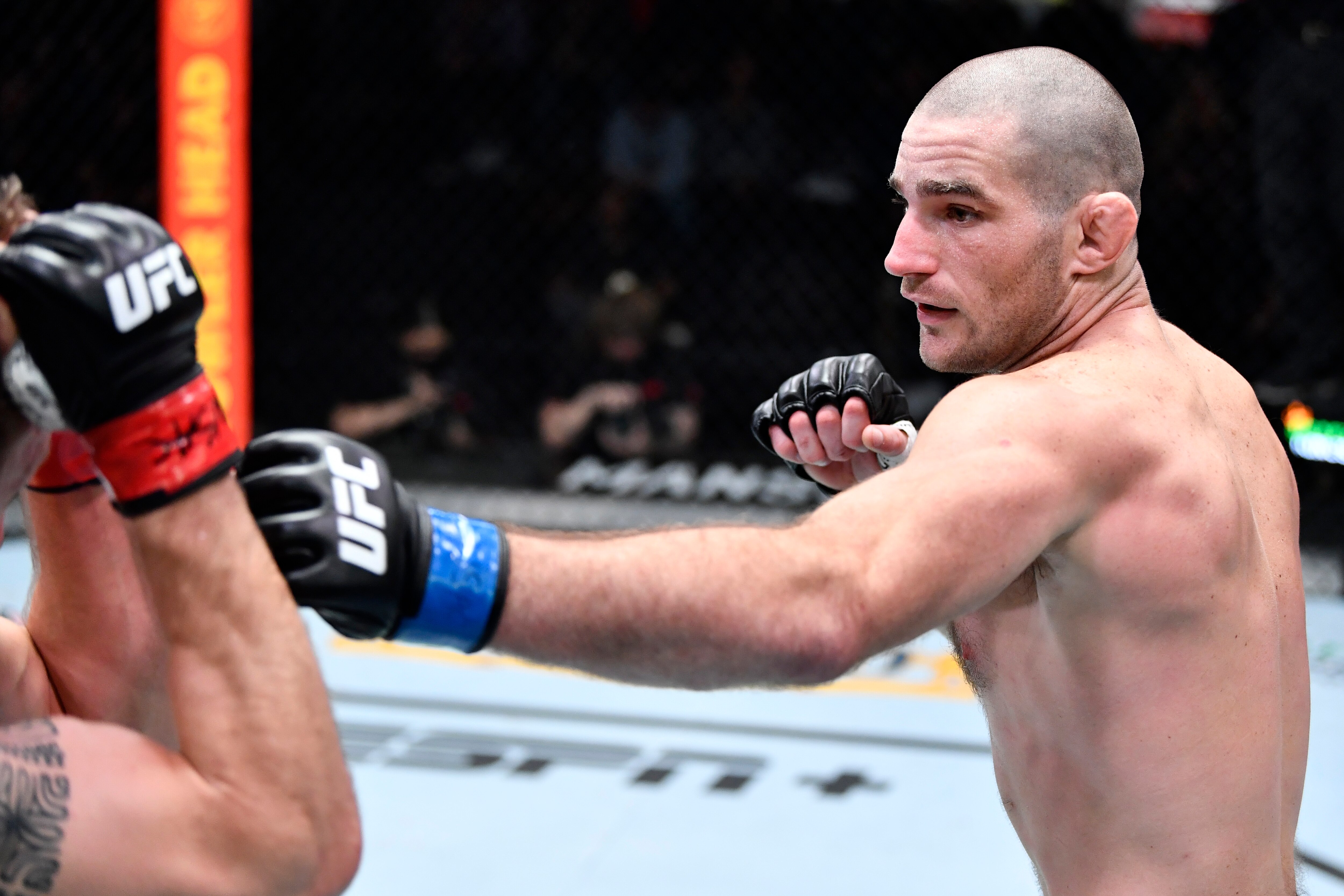 LAS VEGAS, NEVADA - FEBRUARY 05: (R-L) Sean Strickland punches Jack Hermansson of Sweden in their middleweight fight during the UFC Fight Night event at UFC APEX on February 05, 2022 in Las Vegas, Nevada. (Photo by Chris Unger/Zuffa LLC)