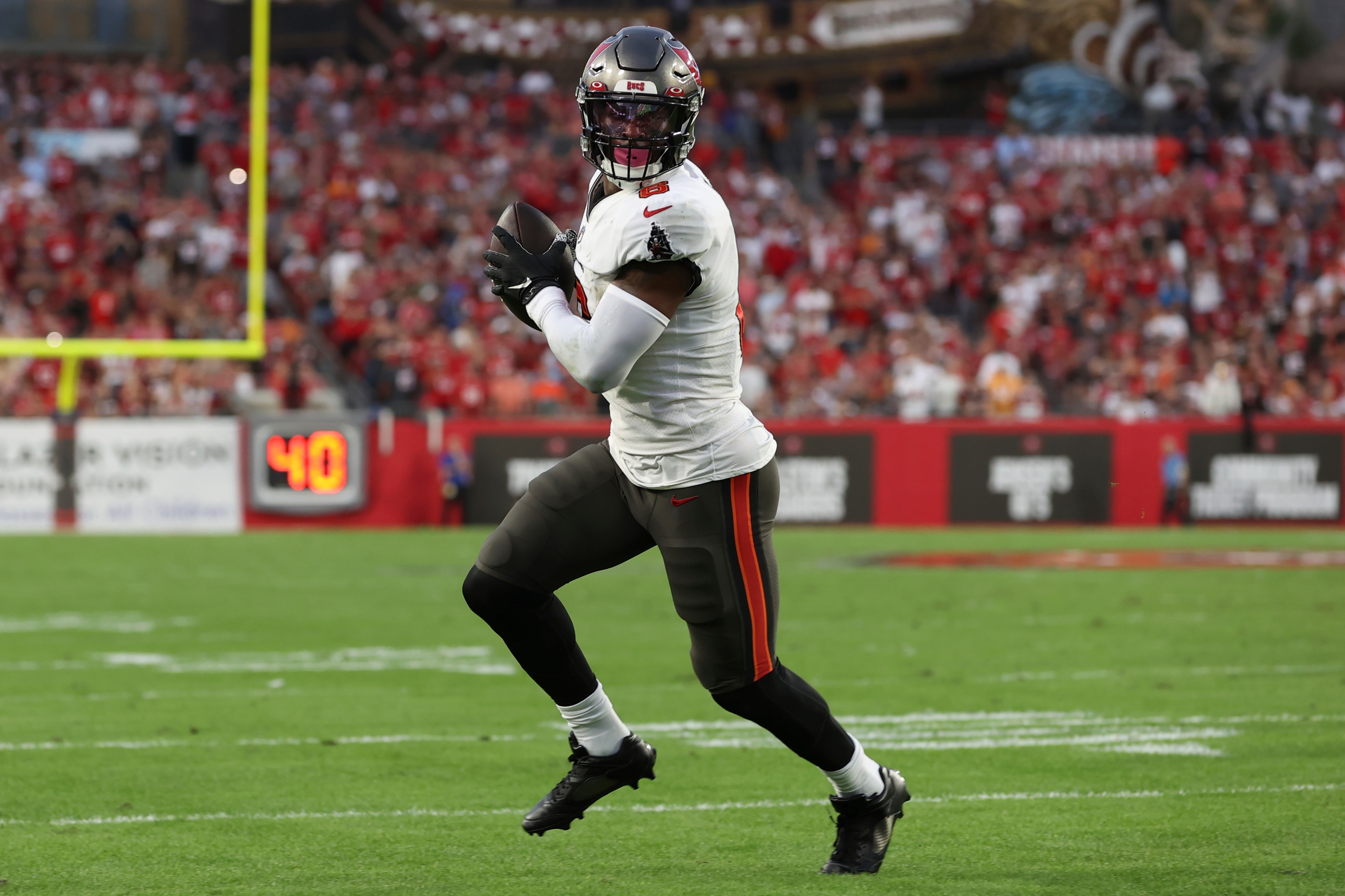 Tampa Bay Buccaneers running back Le'Veon Bell (6) scores against the Carolina Panthers during the first half of an NFL football game Sunday, Jan. 9, 2022, in Tampa, Fla. (AP Photo/Mark LoMoglio)