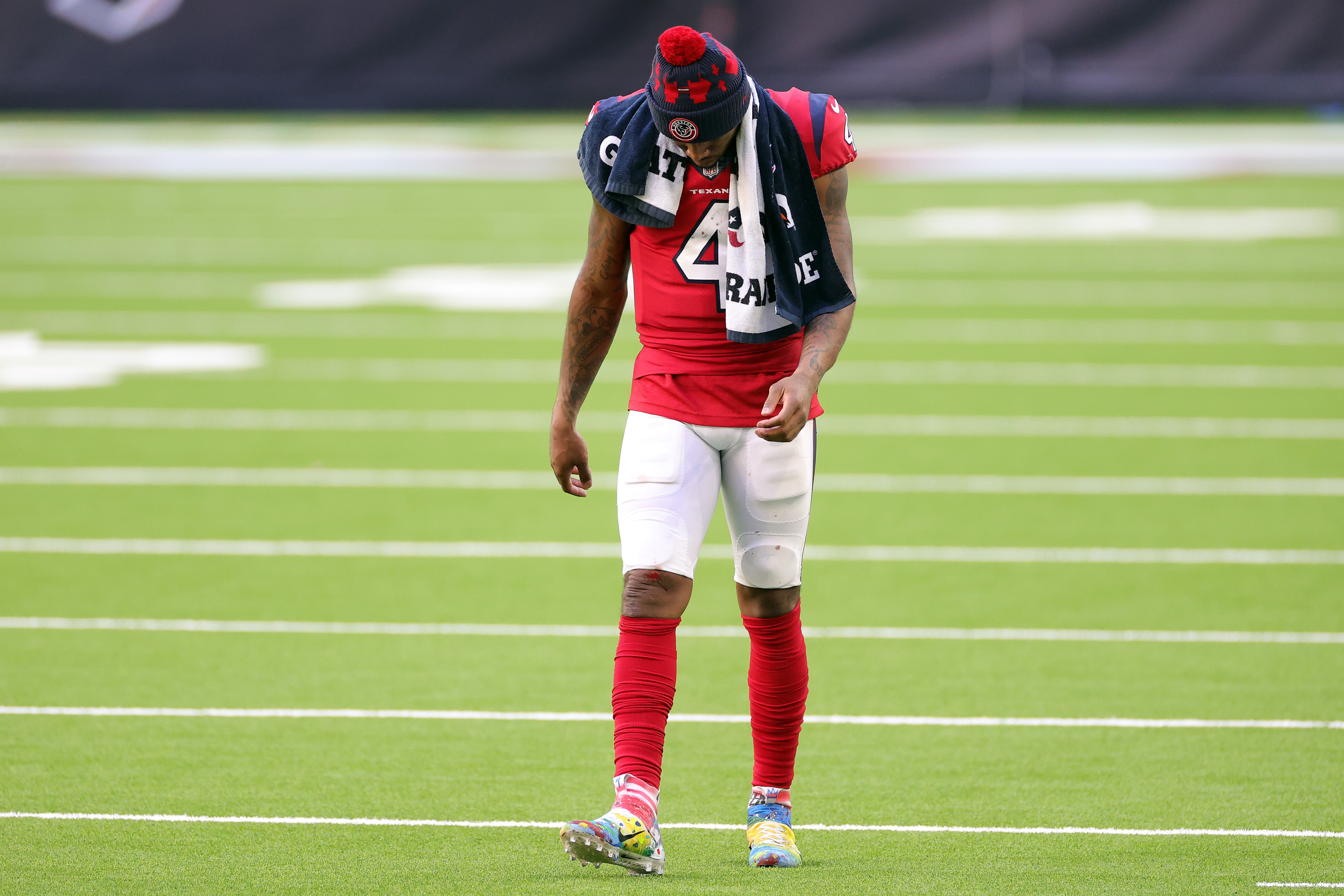 HOUSTON, TEXAS - DECEMBER 06:  Deshaun Watson #4 of the Houston Texans reacts after the teams 26-20 loss against the Indianapolis Colts at NRG Stadium on December 06, 2020 in Houston, Texas. (Photo by Carmen Mandato/Getty Images)